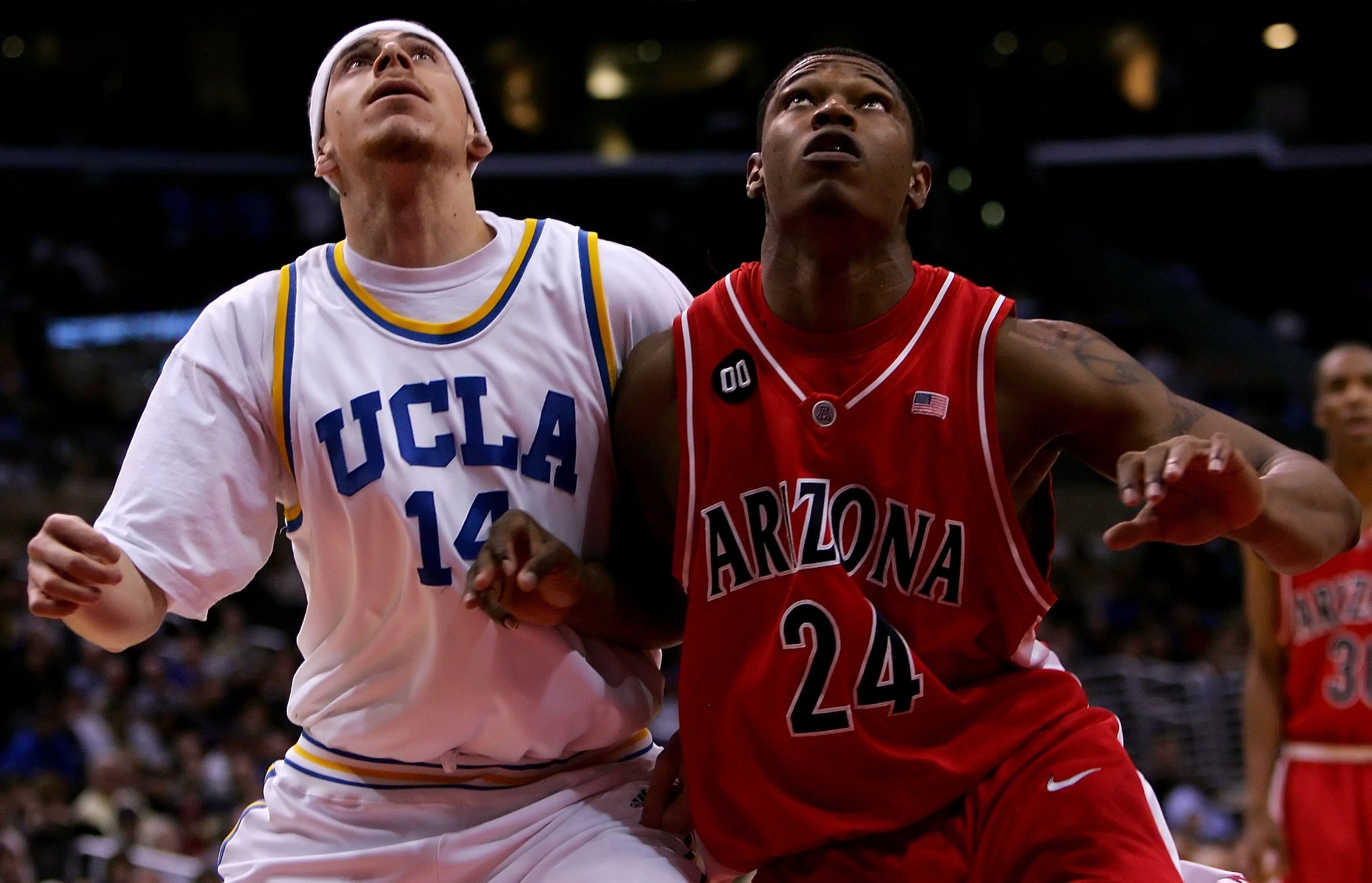 LOS ANGELES, CA - MARCH 10: Lorenzo Mata #14 of the UCLA Bruins and Fendi Onobun #24 of the Arizona Wildcats battle for position under the basket during the semifinals of the 2006 Pacific Life Pac-10 Men's Basketball Tournament on March 10, 2006 at Stapl LOS ANGELES, CA - MARCH 10: Lorenzo Mata #14 of the UCLA Bruins and Fendi Onobun #24 of the Arizona Wildcats battle for position under the basket during the semifinals of the 2006 Pacific Life Pac-10 Men's Basketball Tournament on March 10, 2006 at Stapl