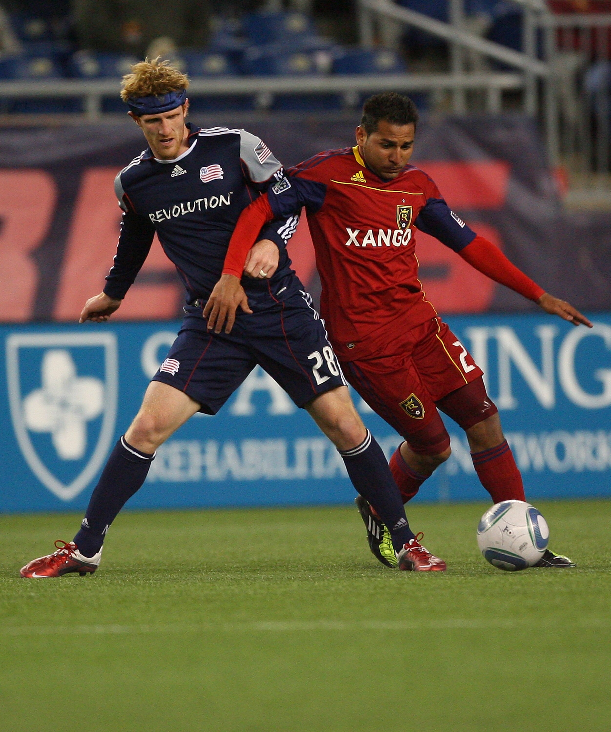 FOXBORO, MA - APRIL 9:  Paulo Araujo #23 of Real Salt Lake battles against Pat Phalen #28 of the New England Revolution at Gillette Stadium April 9, 2011 in Foxboro, Massachusetts. (Photo by Gail Oskin/Getty Images)