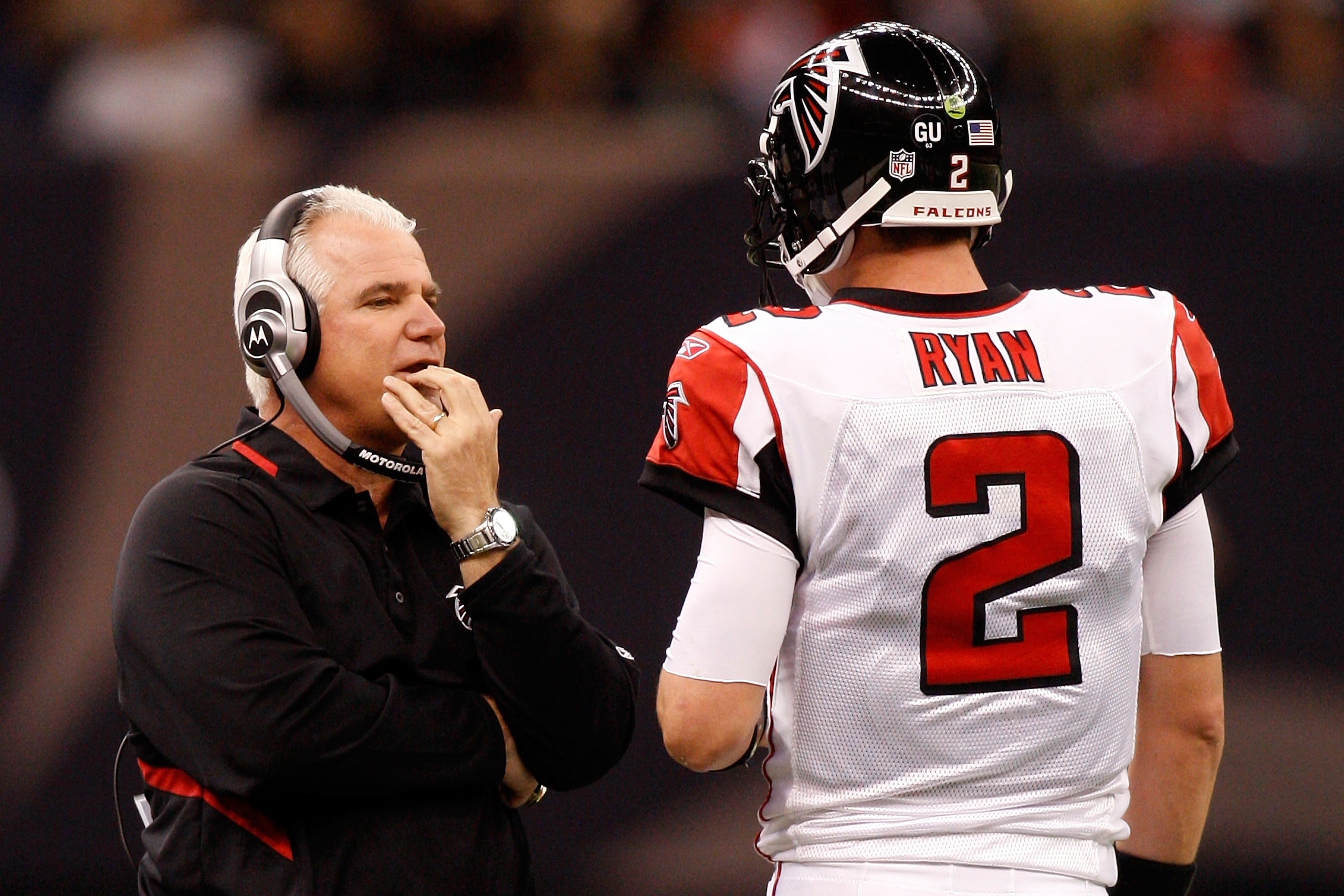 NEW ORLEANS - DECEMBER 07:  Head coach Mike Smith talks with quarterback Matt Ryan #2 of the Atlanta Falcons throws a pass against the New Orleans Saints on December 7, 2008 at the Superdome in New Orleans, Louisiana.   The Saints defeated the Falcons 29-
