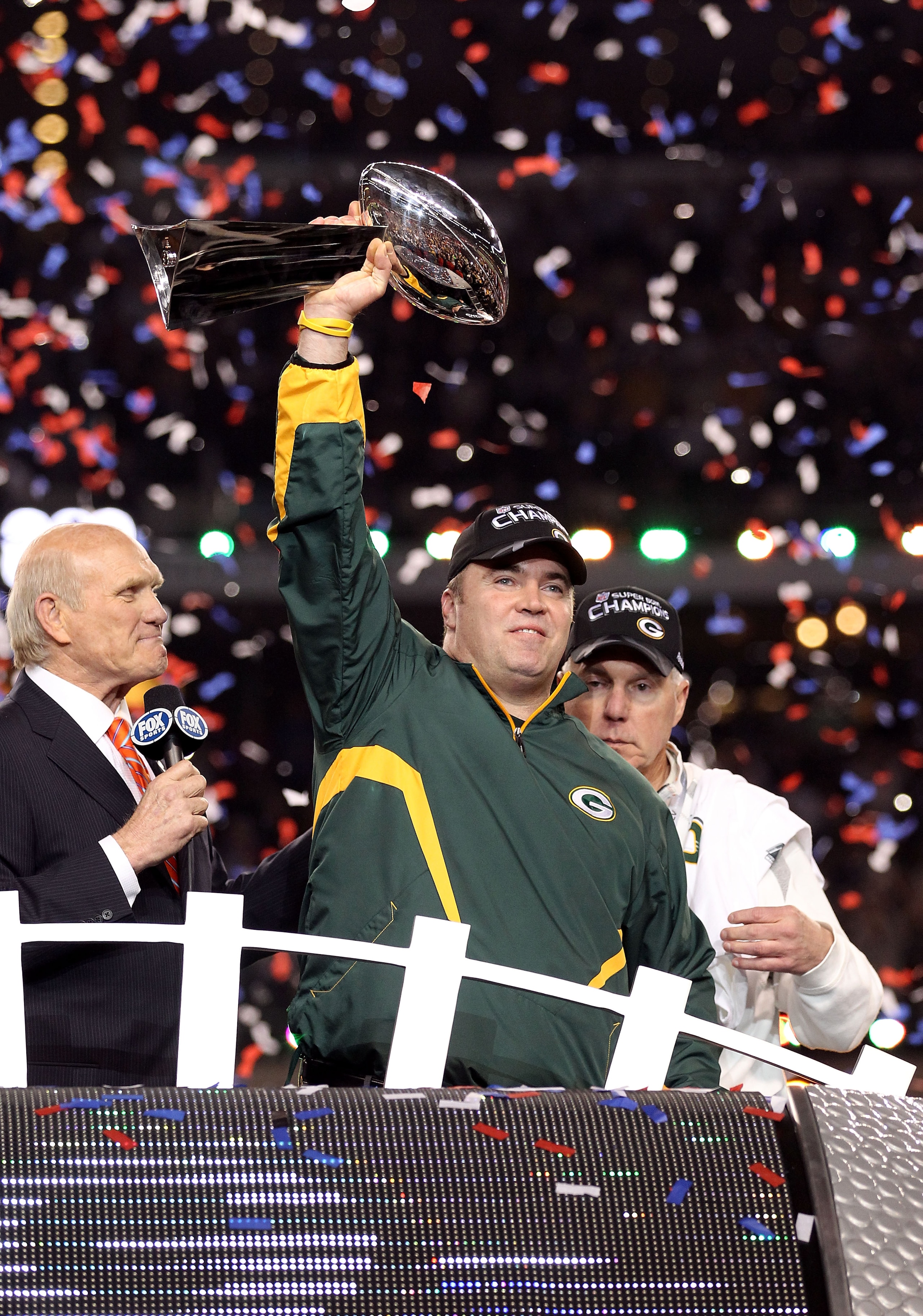 ARLINGTON, TX - FEBRUARY 06:  Head coach Mike McCarthy of the Green Bay Packers celebrates with the Vince Lombardi trophy following the Packers 31-25 win in Super Bowl XLV at Cowboys Stadium on February 6, 2011 in Arlington, Texas.  (Photo by Al Bello/Get