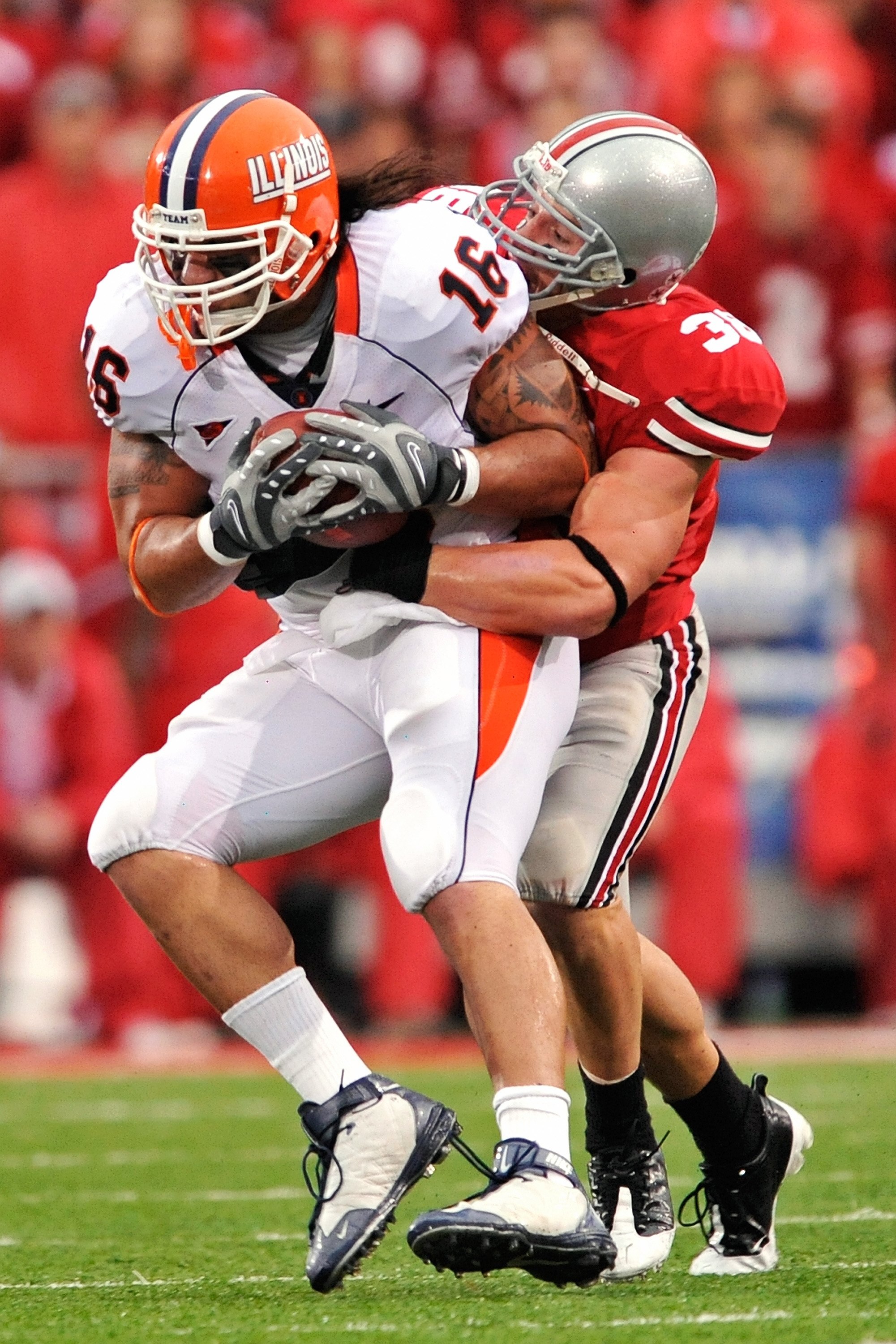 COLUMBUS, OH - SEPTEMBER 26:  Austin Spitler #38 of the Ohio State Buckeyes tackles Michael Hoomanawanui #16 of the Illinois Fighting Illini at Ohio Stadium on September 26, 2009 in Columbus, Ohio.  (Photo by Jamie Sabau/Getty Images)