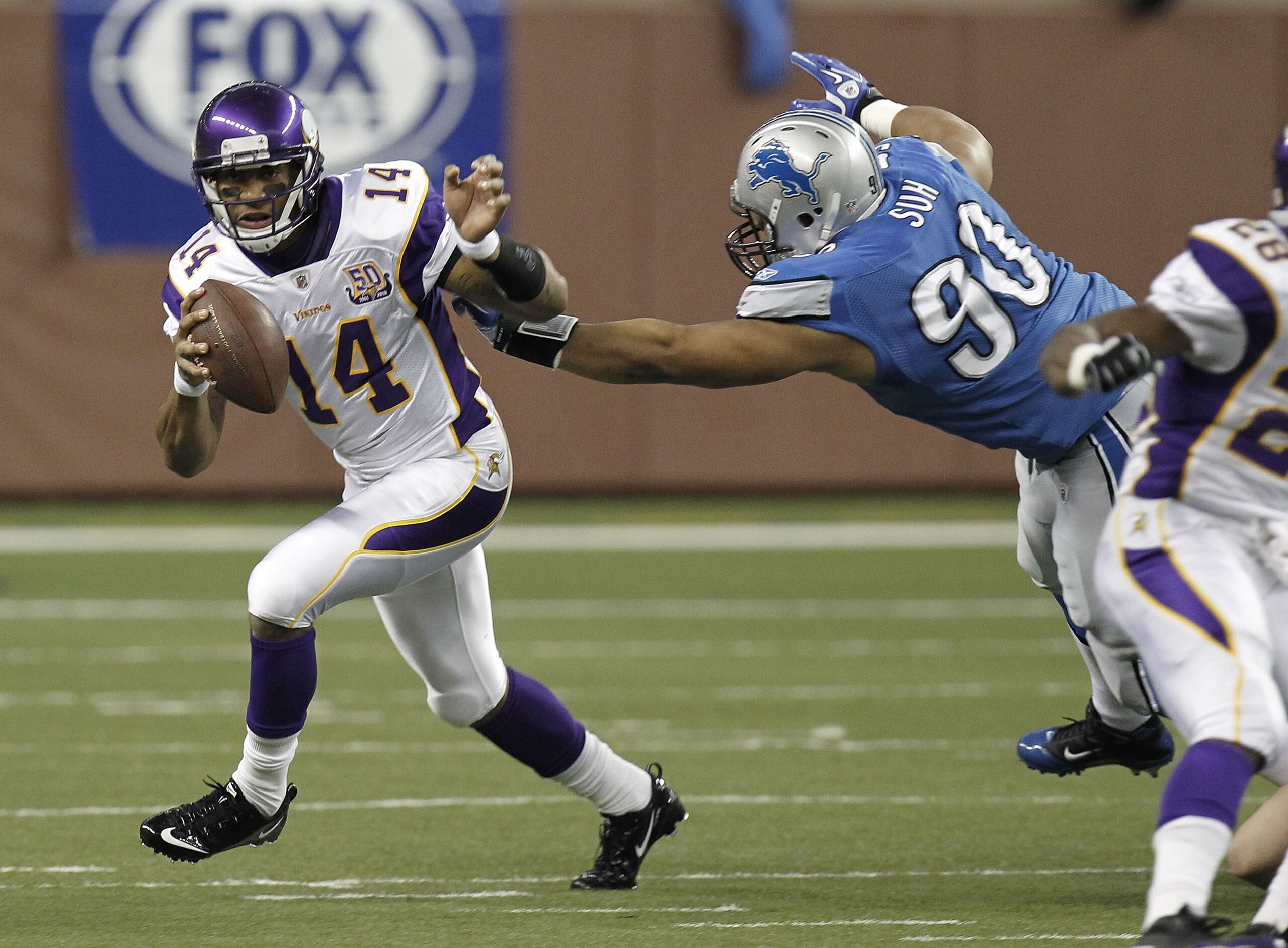 DETROIT, MI - JANUARY 02: Joe Webb #14 of the Minnesota Vikings runs around the tackle of Ndamukong Suh #90 of the Detroit Lions at Ford Field on January 2, 2011 in Detroit, Michigan. (Photo by Gregory Shamus/Getty Images) DETROIT, MI - JANUARY 02: Joe Webb #14 of the Minnesota Vikings runs around the tackle of Ndamukong Suh #90 of the Detroit Lions at Ford Field on January 2, 2011 in Detroit, Michigan. (Photo by Gregory Shamus/Getty Images)