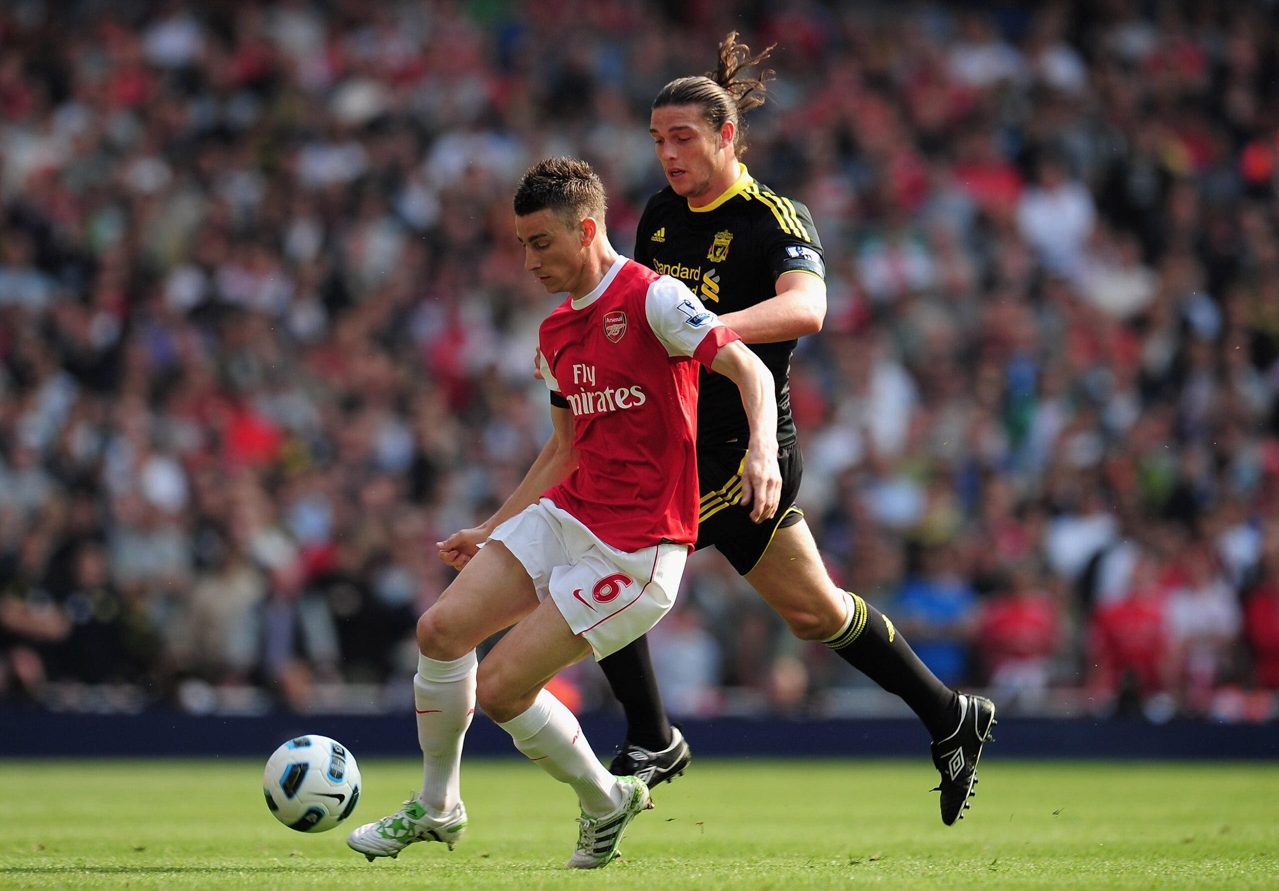 LONDON, ENGLAND - APRIL 17: Andy Carroll of Liverpool closes down Laurent Koscielny of Arsenal during the Barclays Premier League match between Arsenal and Liverpool at the Emirates Stadium on April 17, 2011 in London, England. (Photo by Shaun Botterill LONDON, ENGLAND - APRIL 17: Andy Carroll of Liverpool closes down Laurent Koscielny of Arsenal during the Barclays Premier League match between Arsenal and Liverpool at the Emirates Stadium on April 17, 2011 in London, England. (Photo by Shaun Botterill