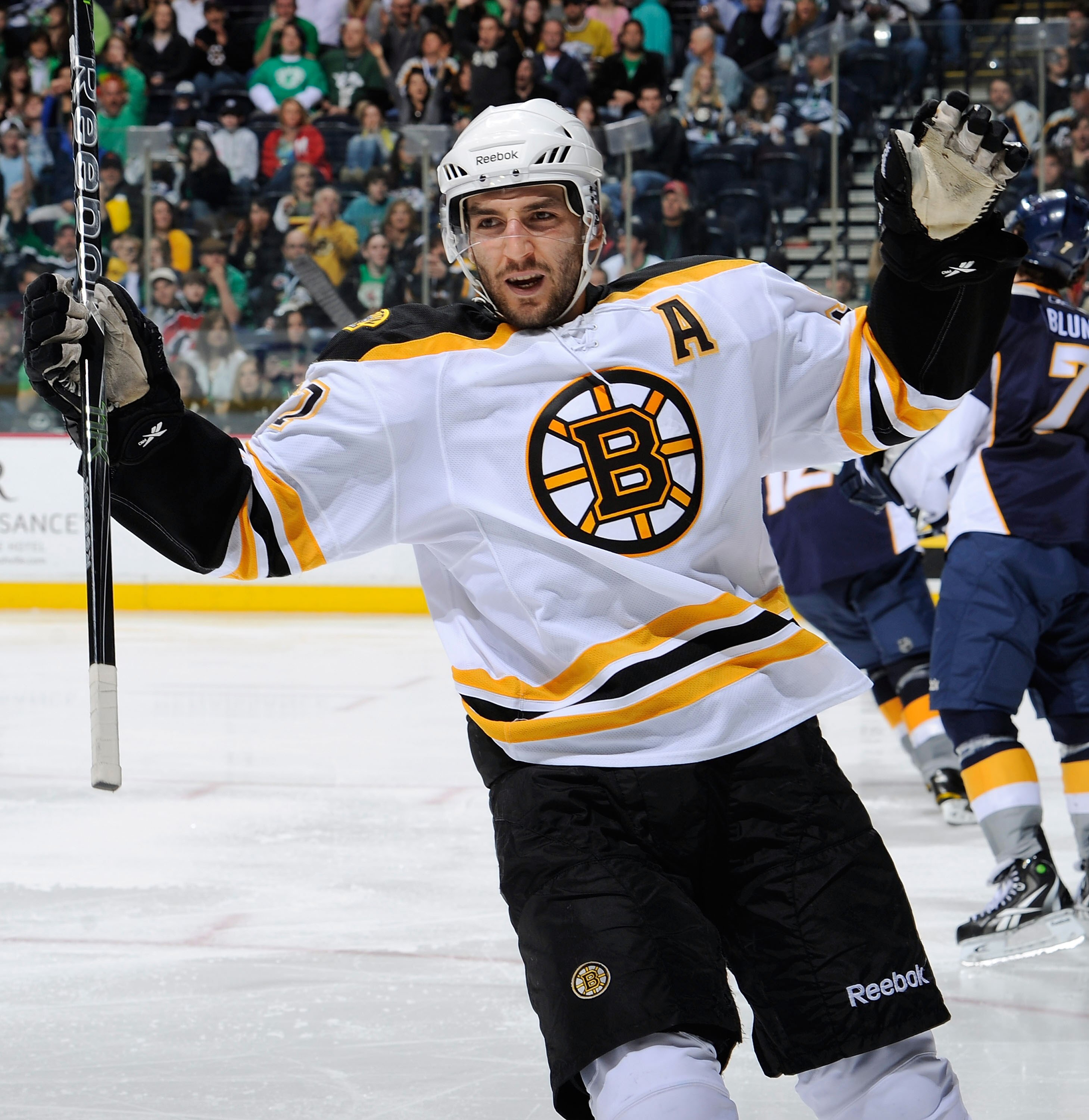 NASHVILLE, TN - MARCH 17:   Patrice Bergeron #37 of the Boston Bruins celebrates after scoring a goal against the Nashville Predators on March 17, 2011 at the Bridgestone Arena in Nashville, Tennessee.  (Photo by Frederick Breedon/Getty Images)