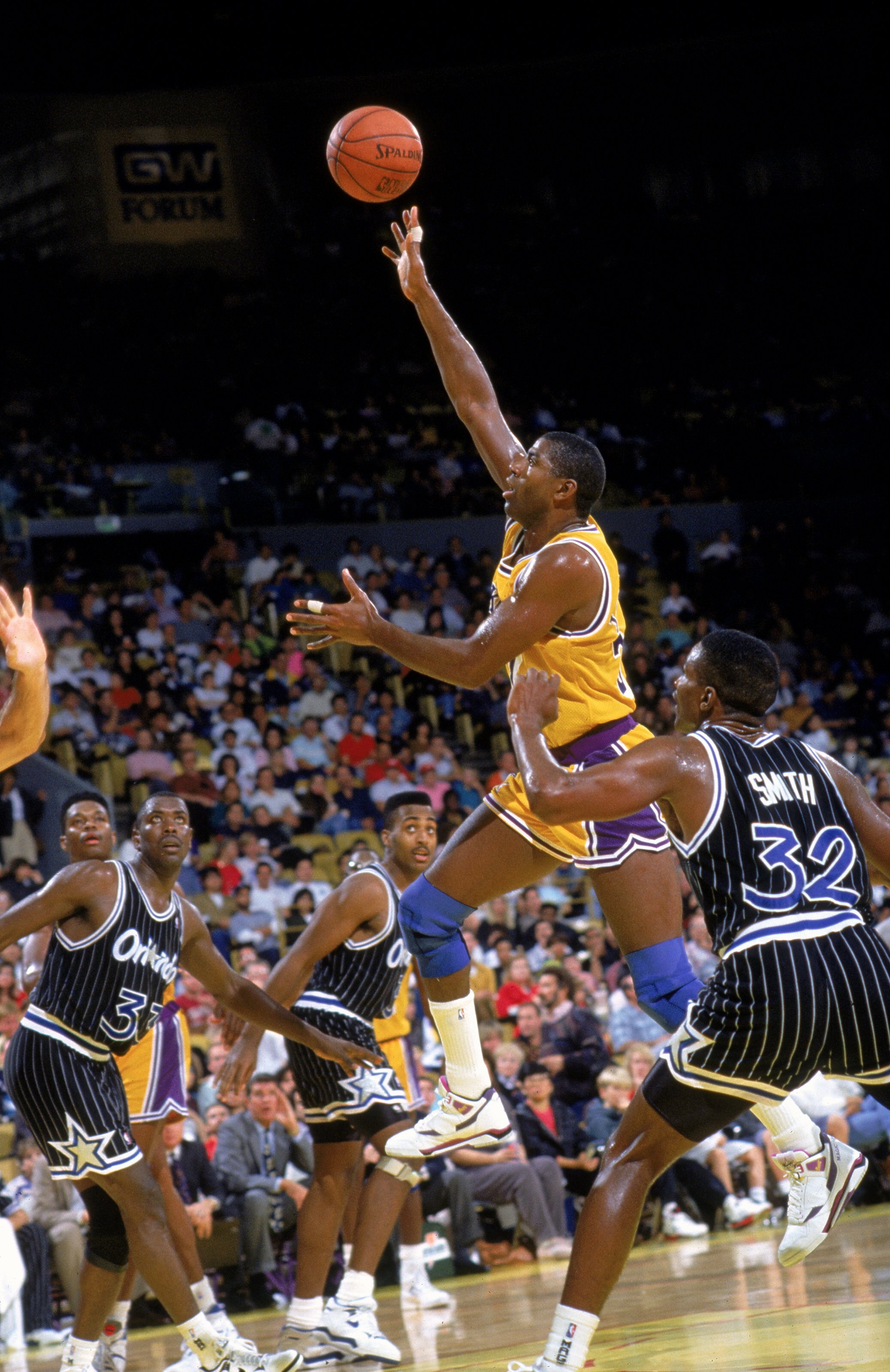 1990: Magic Johnson #32 of the Los Angeles Lakers makes a lay-up during a game against the Orlando Magic.   Mandatory Credit: Stephen Dunn  /Allsport