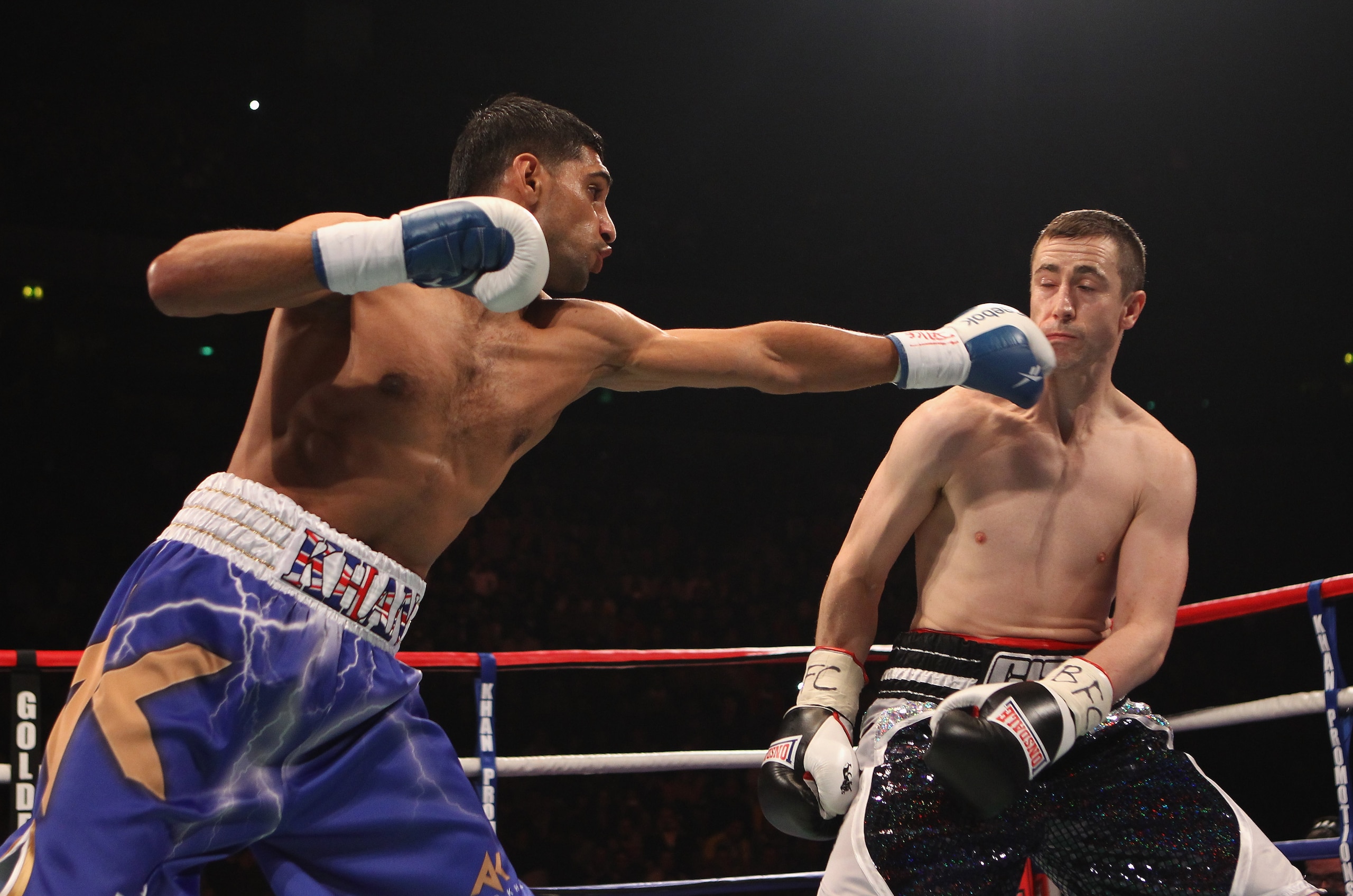 MANCHESTER, ENGLAND - APRIL 16:  Amir Khan hits Paul McCloskey during the WBA Light-Welterweight Championship fight between Amir Khan and Paul McCloskey at MEN Arena on April 16, 2011 in Manchester, England.  (Photo by Alex Livesey/Getty Images)