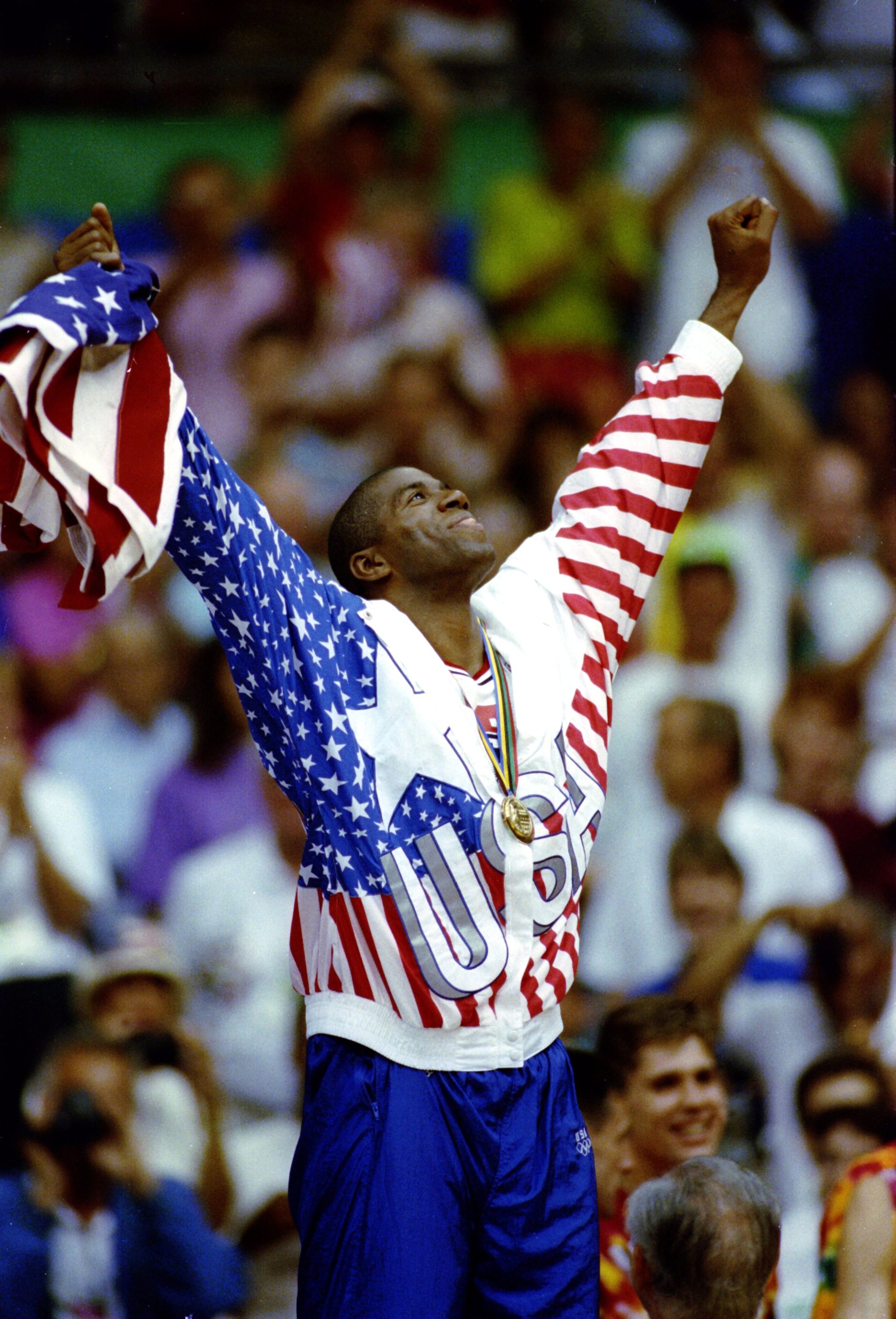 2 OCT 1992:  MAGIC JOHNSON OF THE UNITED CELEBRATES AFTER RECEIVING HIS GOLD MEDAL ON THE 1ST PLACE PODIUM DURING THE 1992 BARCELONA OLYMPICS IN BARCELONA, SPAIN. Mandatory Credit: Mike Powell/ALLSPORT