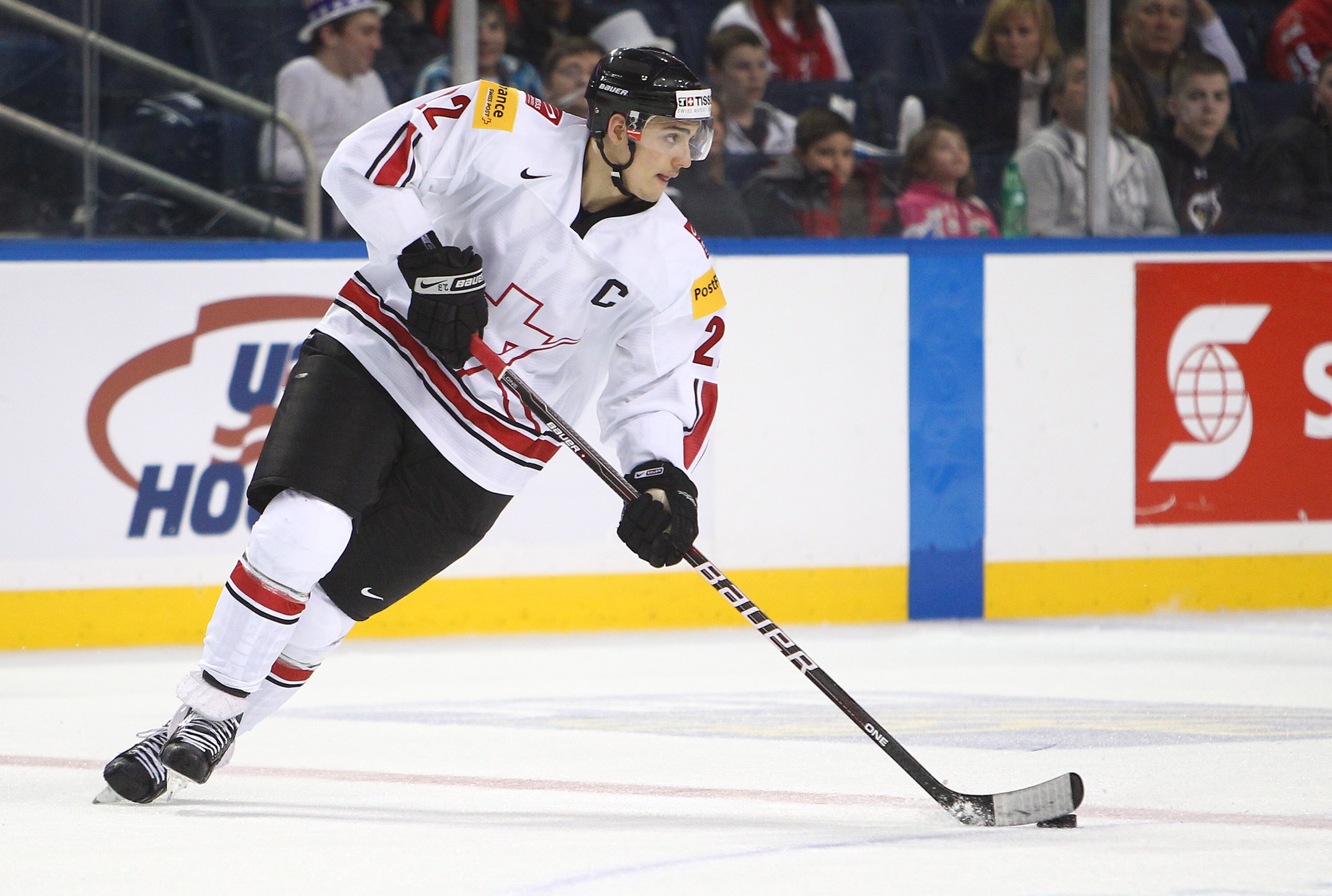 BUFFALO, NY - DECEMBER 31: Forward Nino Niederreiter #22 of Switzerland carries the puck during the 2011 IIHF World U20 Championship game between USA and Switzerland on December 31, 2010 at HSBC Arena in Buffalo, New York. (Photo by Tom Szczerbowski/Getty