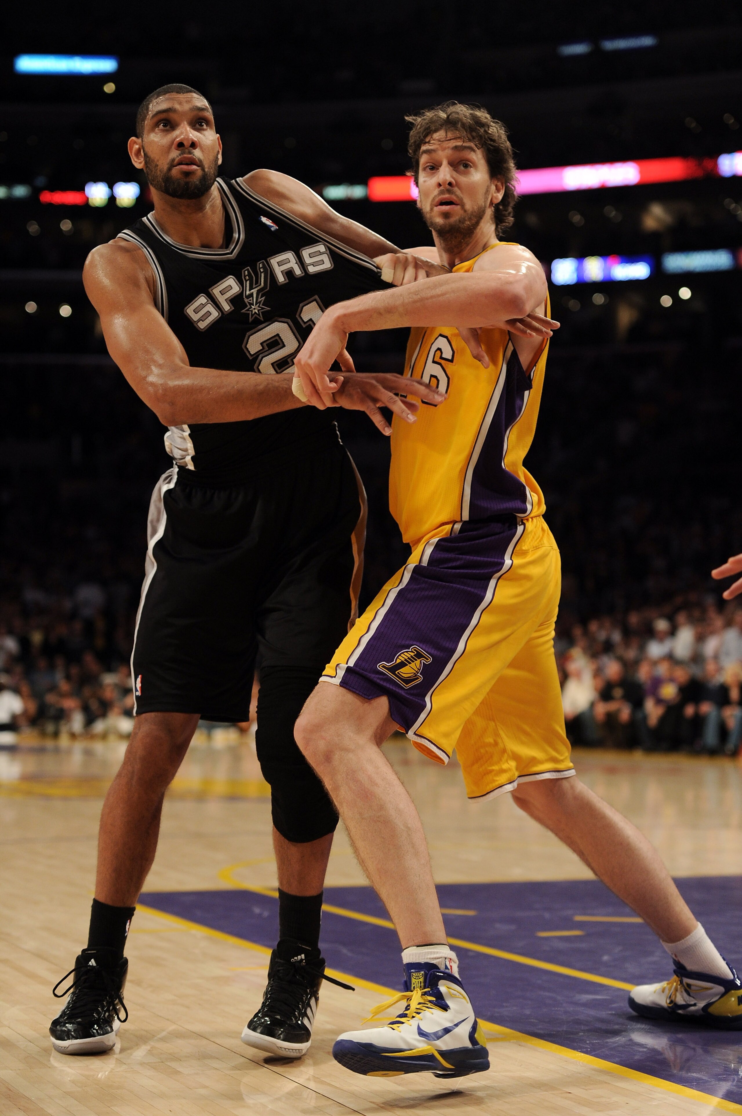 LOS ANGELES, CA - FEBRUARY 03:  Tim Duncan #21 of the San Antonio Spurs is guarded by Pau Gasol #16 of the Los Angeles Lakers at Staples Center on February 3, 2011 in Los Angeles, California.  NOTE TO USER: User expressly acknowledges and agrees that, by