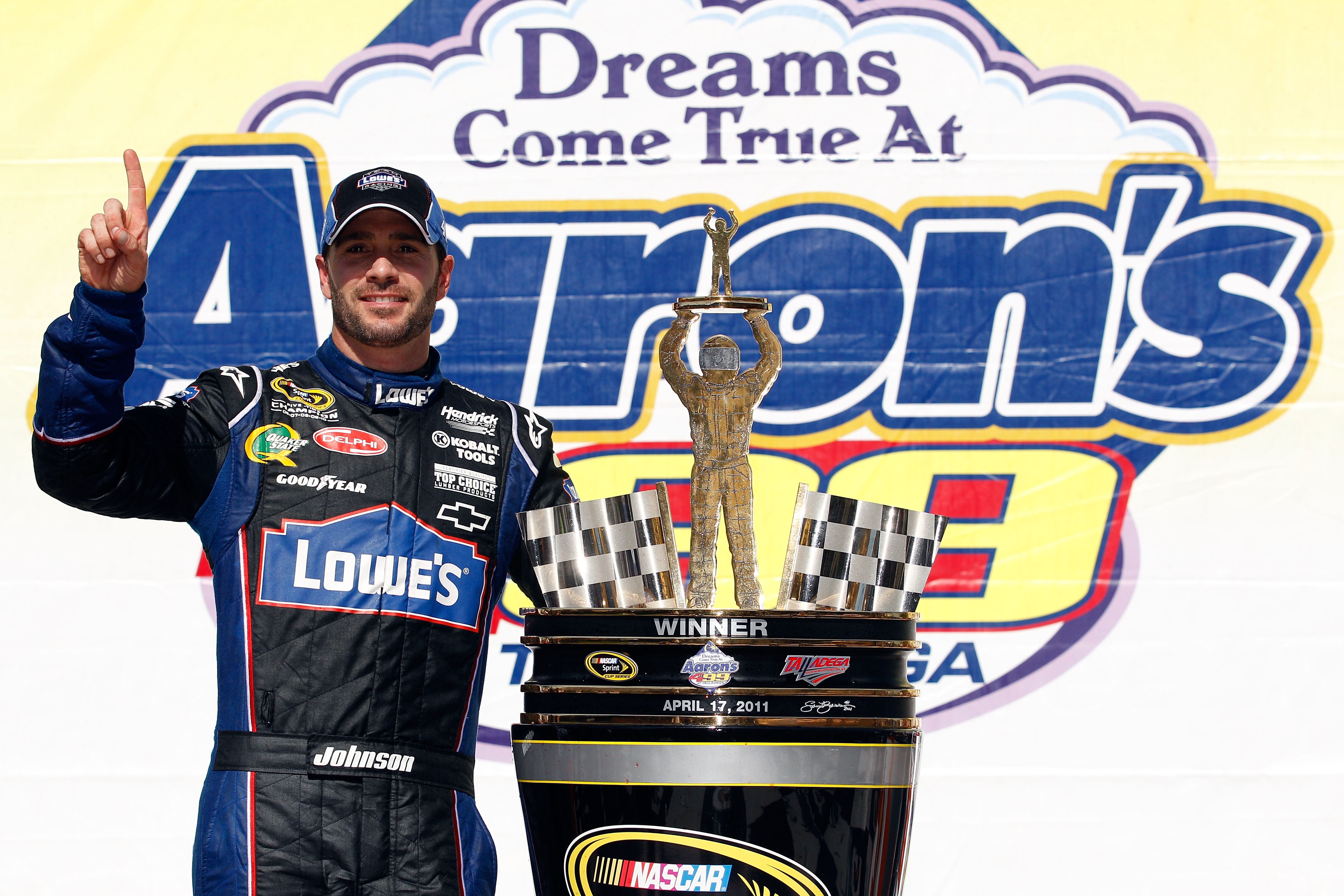 TALLADEGA, AL - APRIL 17:  Jimmie Johnson, driver of the #48 Lowe's Chevrolet, poses in Victory Lane after winning the NASCAR Sprint Cup Series Aaron's 499 at Talladega Superspeedway on April 17, 2011 in Talladega, Alabama.  (Photo by Chris Graythen/Getty