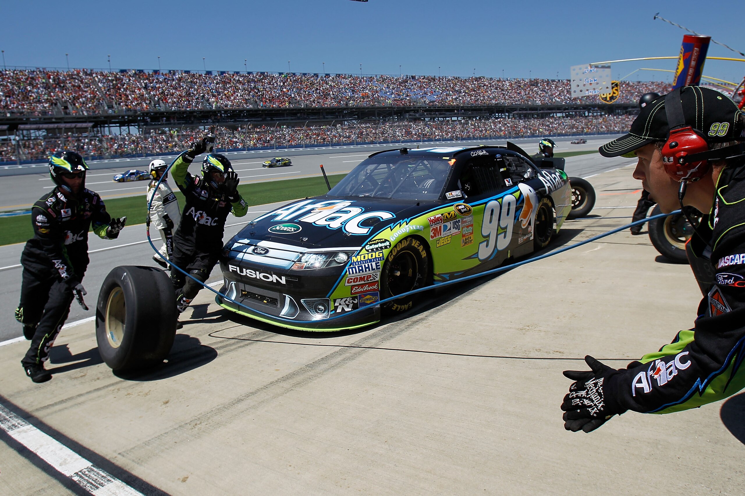 TALLADEGA, AL - APRIL 17:  Carl Edwards, driver of the #99 Aflac Ford, comes in for a pit stop during the NASCAR Sprint Cup Series Aaron's 499 at Talladega Superspeedway on April 17, 2011 in Talladega, Alabama.  (Photo by Todd Warshaw/Getty Images for NAS