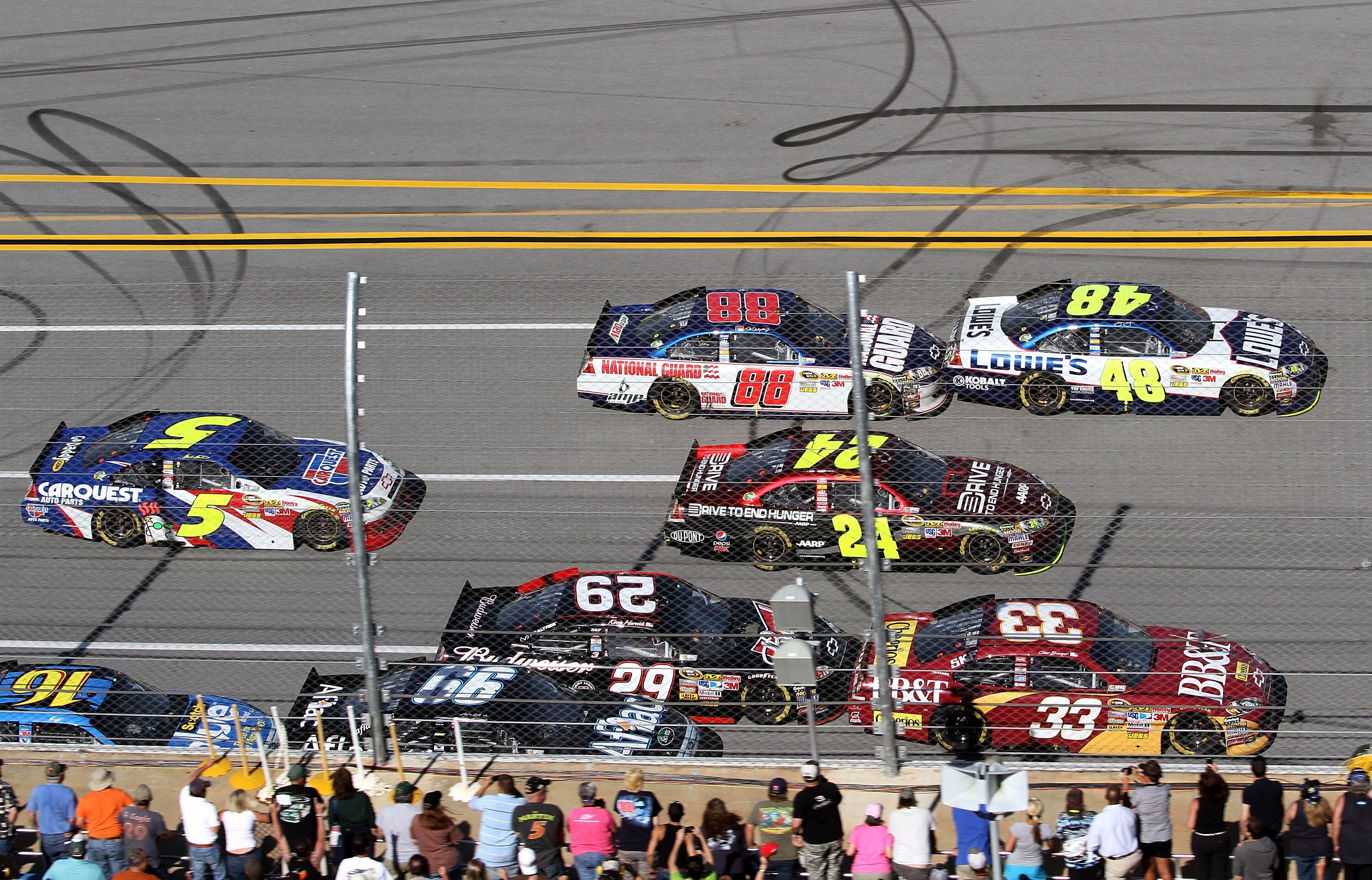 TALLADEGA, AL - APRIL 17:  Clint Bowyer, driver of the #33 BB&T Chevrolet, Jeff Gordon, driver of the #24 Drive to End Hunger/AARP Chevrolet, and Jimmie Johnson, driver of the #48 Lowe's Chevrolet, lead Kevin Harvick, driver of the #29 Budweiser Chevrolet
