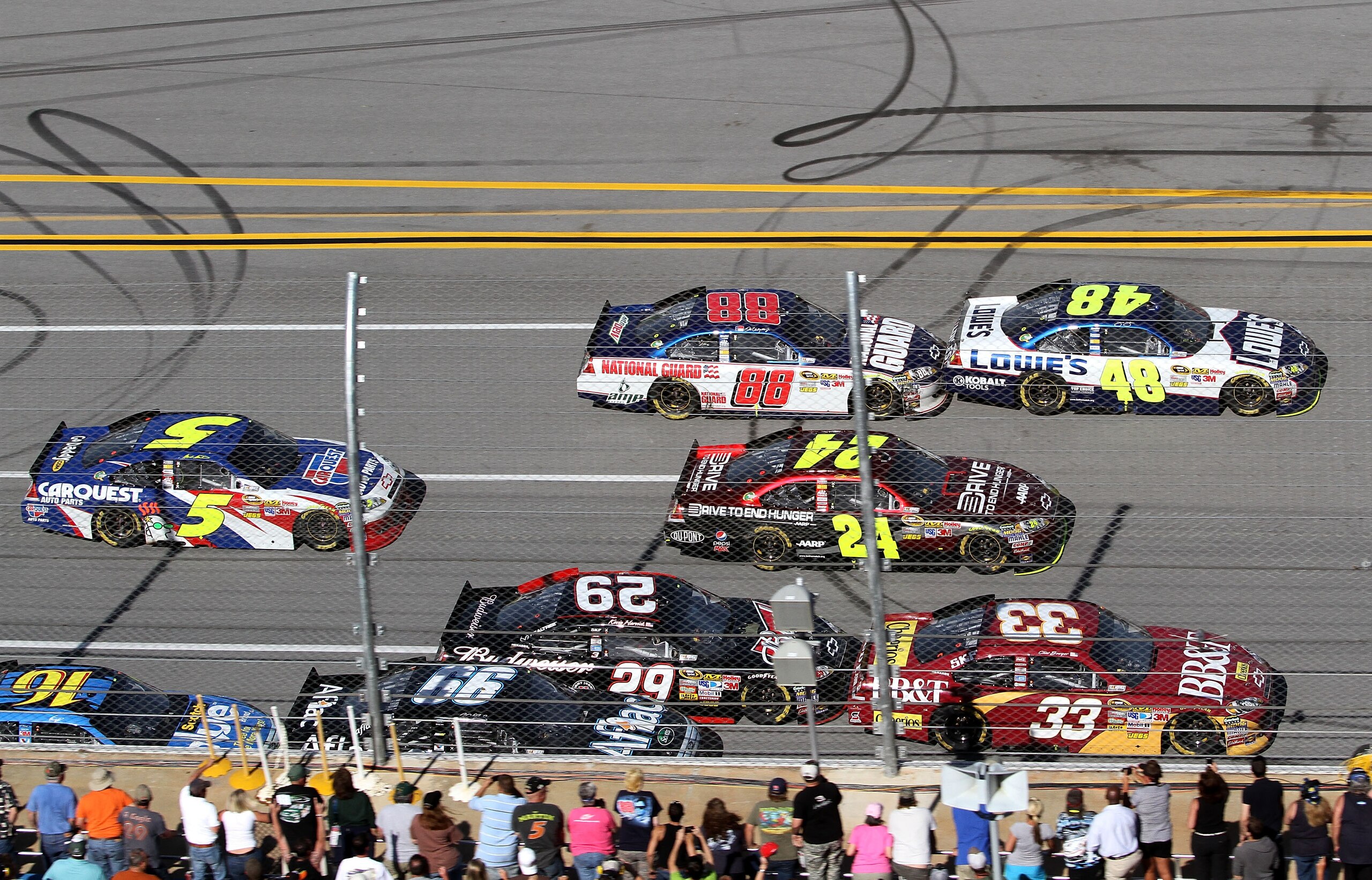 TALLADEGA, AL - APRIL 17:  Clint Bowyer, driver of the #33 BB&T Chevrolet, Jeff Gordon, driver of the #24 Drive to End Hunger/AARP Chevrolet, and Jimmie Johnson, driver of the #48 Lowe's Chevrolet, lead Kevin Harvick, driver of the #29 Budweiser Chevrolet