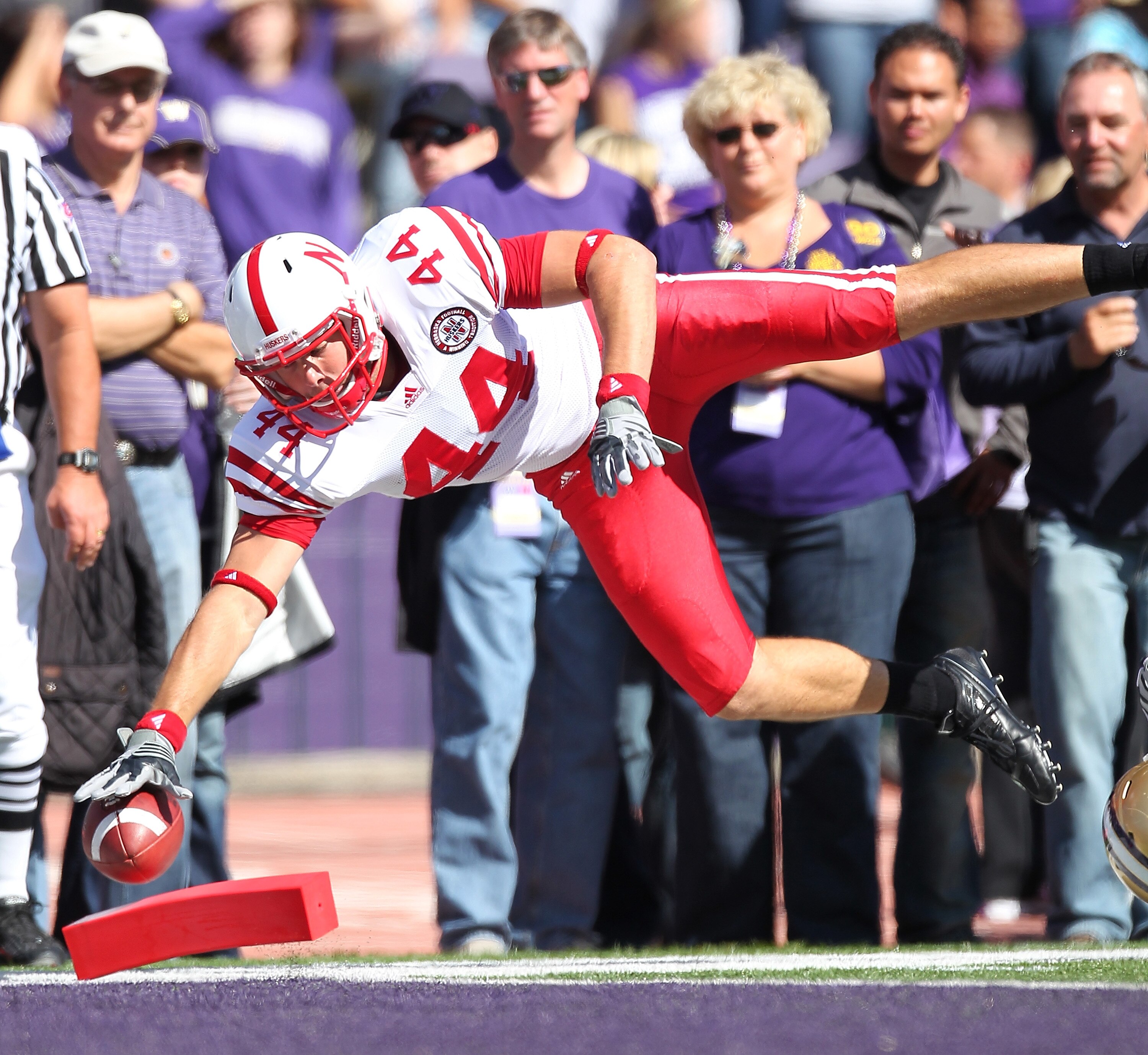 SEATTLE - SEPTEMBER 18:  Tight end Mike McNeill #44 of the Nebraska Cornhuskers scores a touchdown in the first quarter against the Washington Huskies on September 18, 2010 at Husky Stadium in Seattle, Washington. The Cornhuskers defeated the Huskies 56-2