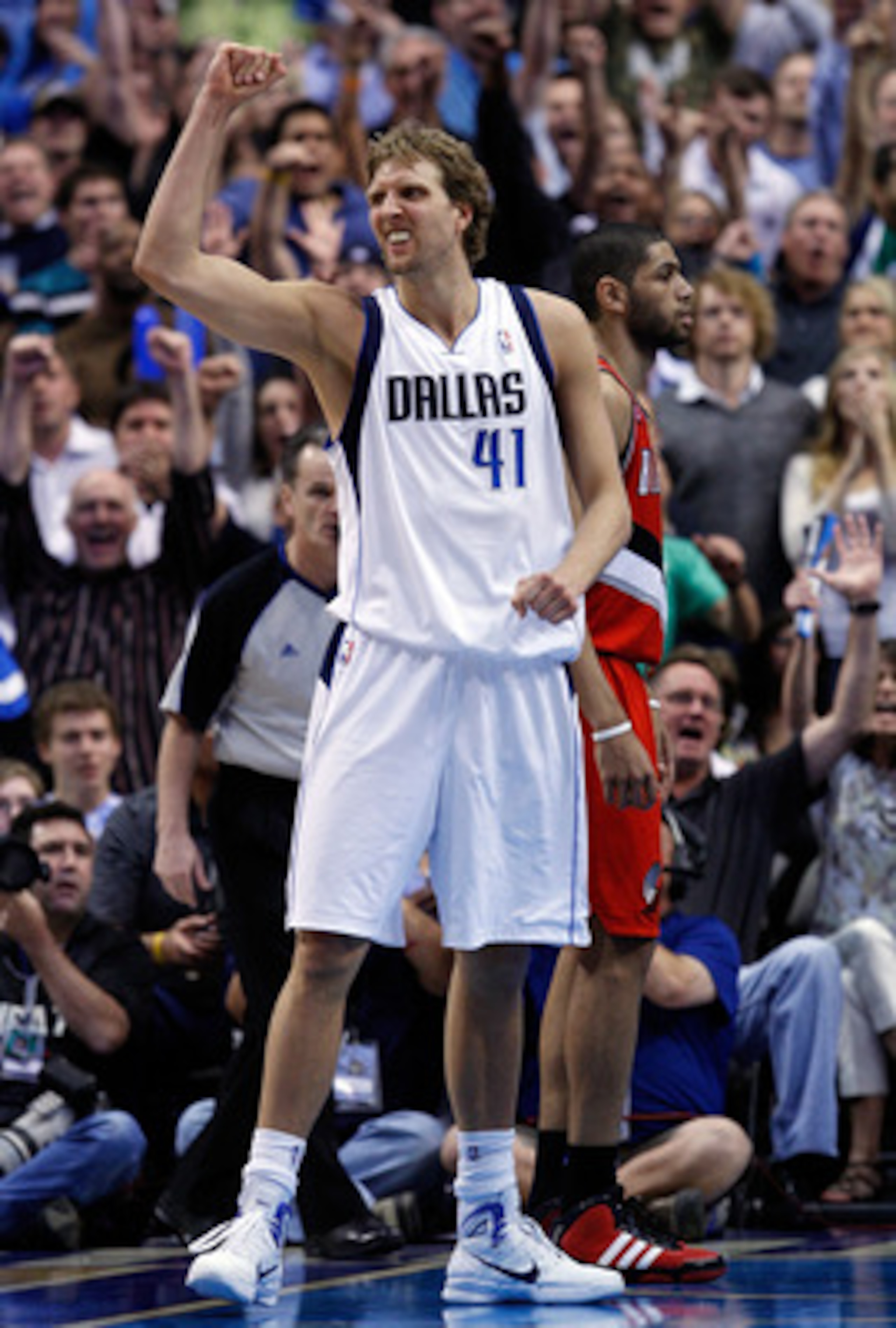 DALLAS, TX - APRIL 16:  Forward Dirk Nowitzki #41 of the Dallas Mavericks reacts against the Portland Trail Blazers in Game One of the Western Conference Quarterfinals during the 2011 NBA Playoffs on April 16, 2011 at American Airlines Center in Dallas, T