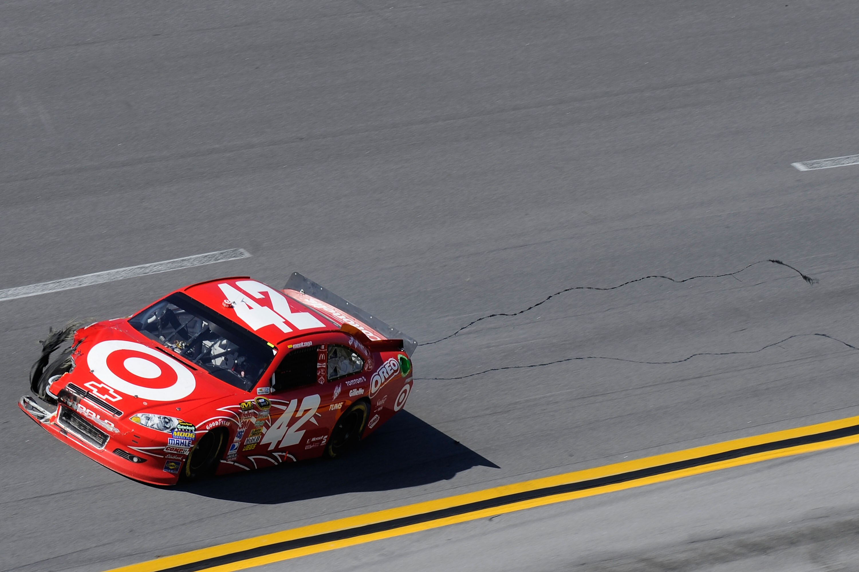 TALLADEGA, AL - APRIL 17:  Juan Pablo Montoya, driver of the #42 Target Chevrolet, drives with damage after a crash during the NASCAR Sprint Cup Series Aaron's 499 at Talladega Superspeedway on April 17, 2011 in Talladega, Alabama.  (Photo by John Harrels