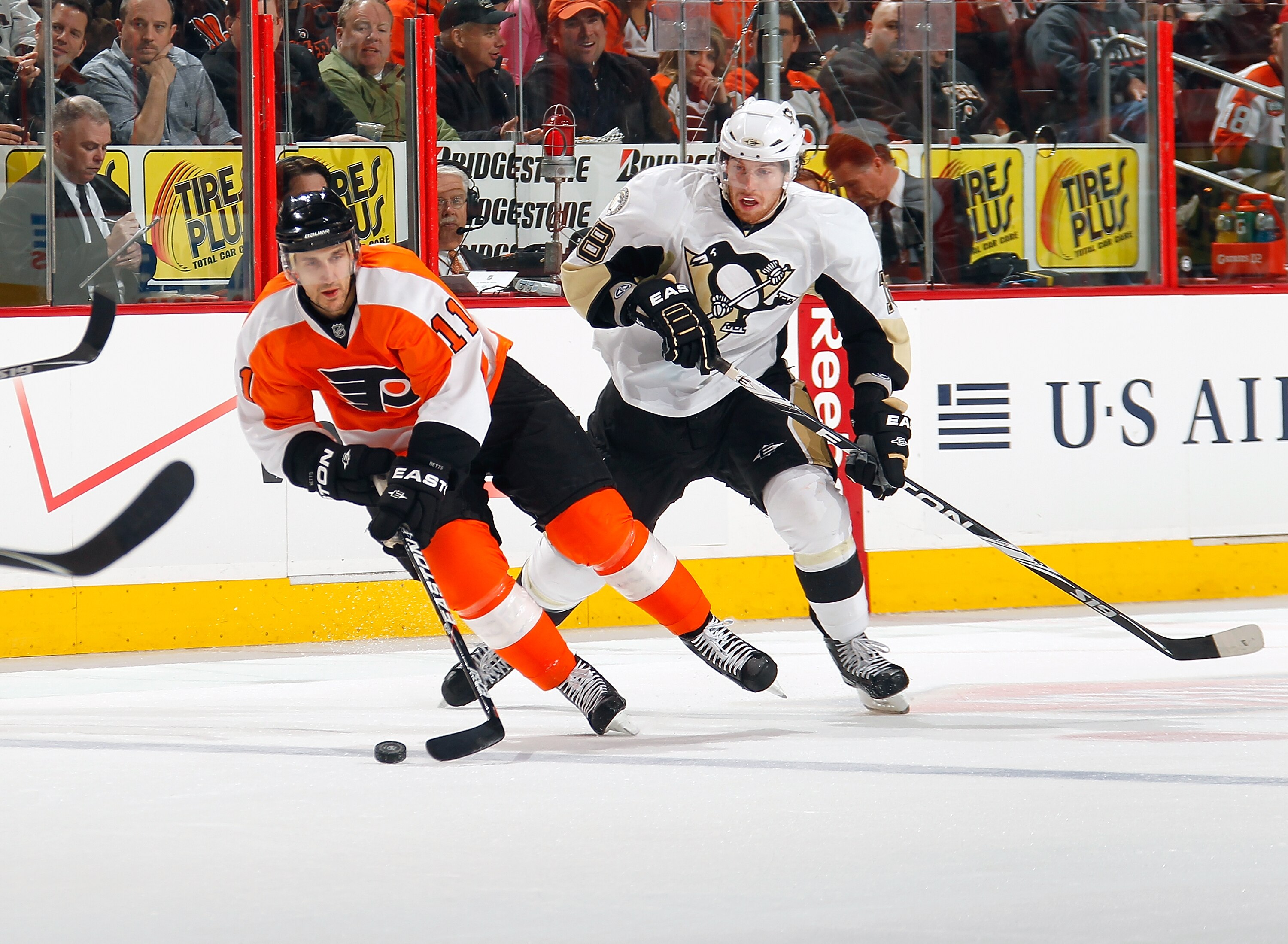 PHILADELPHIA, PA - MARCH 24:  James Neal #18 of the Pittsburgh Penguins and Blair Betts #11 of the Philadelphia Flyers skate for the puck during a game on March 24, 2011 at the Wells Fargo Center in Philadelphia, Pennsylvania.  (Photo by Lou Capozzola/Get