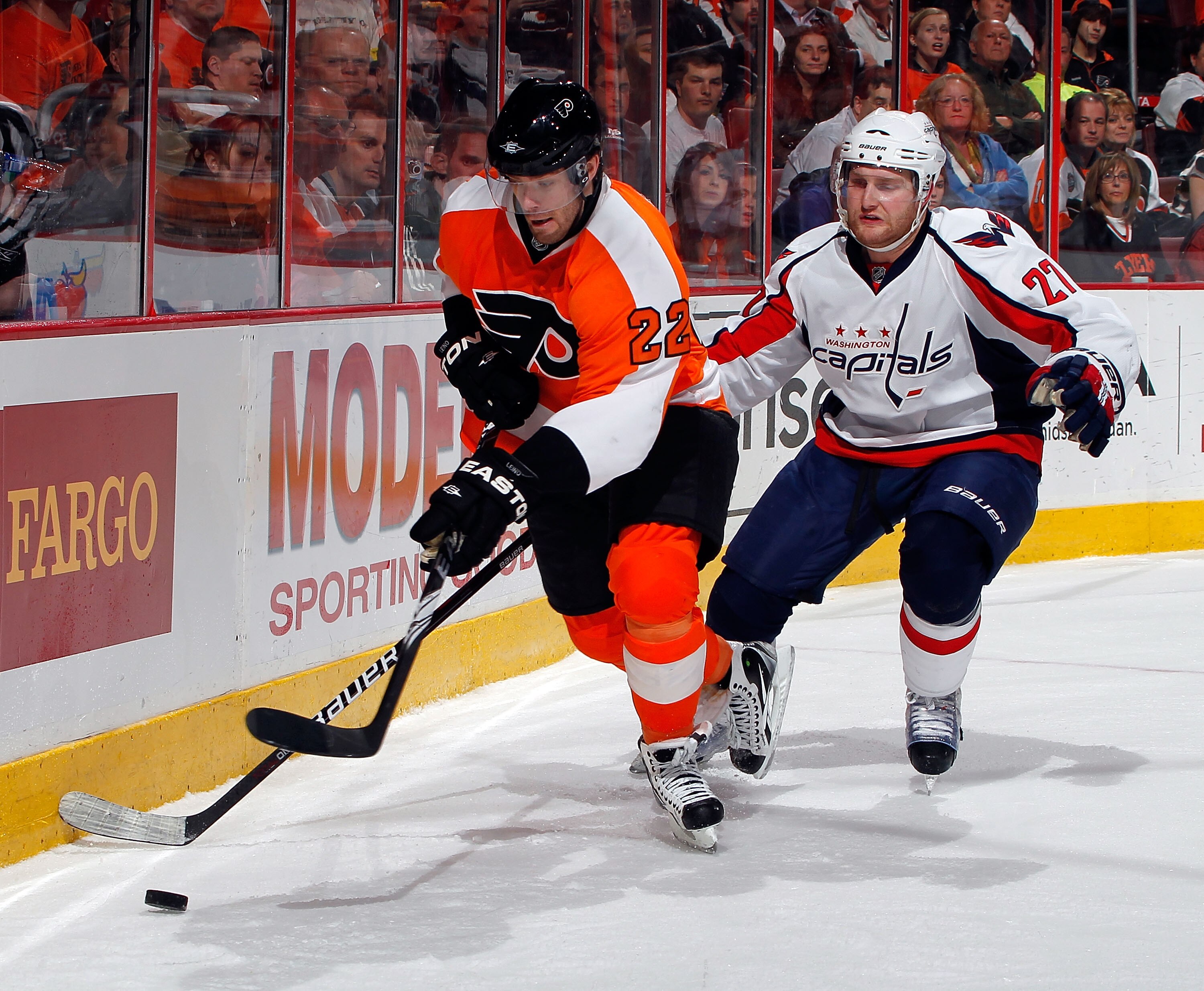 PHILADELPHIA, PA - MARCH 22:  Karl Azner #27 of the Washington Capitals skates after Ville Leino #22 of the Philadelphia Flyers during an NHL hockey game at the Wells Fargo Center on March 22, 2011 in Philadelphia, Pennsylvania.  (Photo by Paul Bereswill/