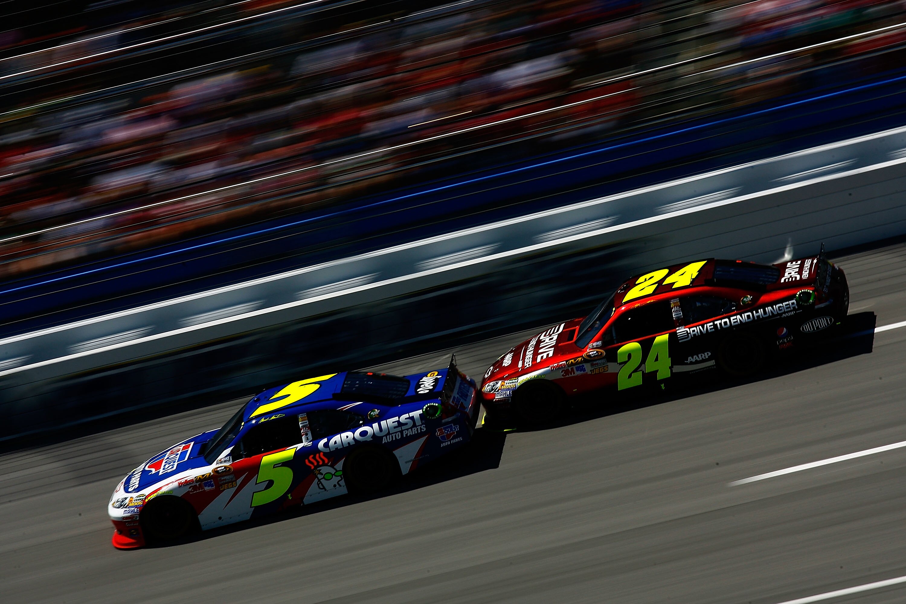 TALLADEGA, AL - APRIL 17:  Mark Martin, driver of the #5 CARQUEST/GoDaddy.com Chevrolet, leads Jeff Gordon, driver of the #24 Drive To End Hunger/AARP Chevrolet, during the NASCAR Sprint Cup Series Aaron's 499 at Talladega Superspeedway on April 17, 2011