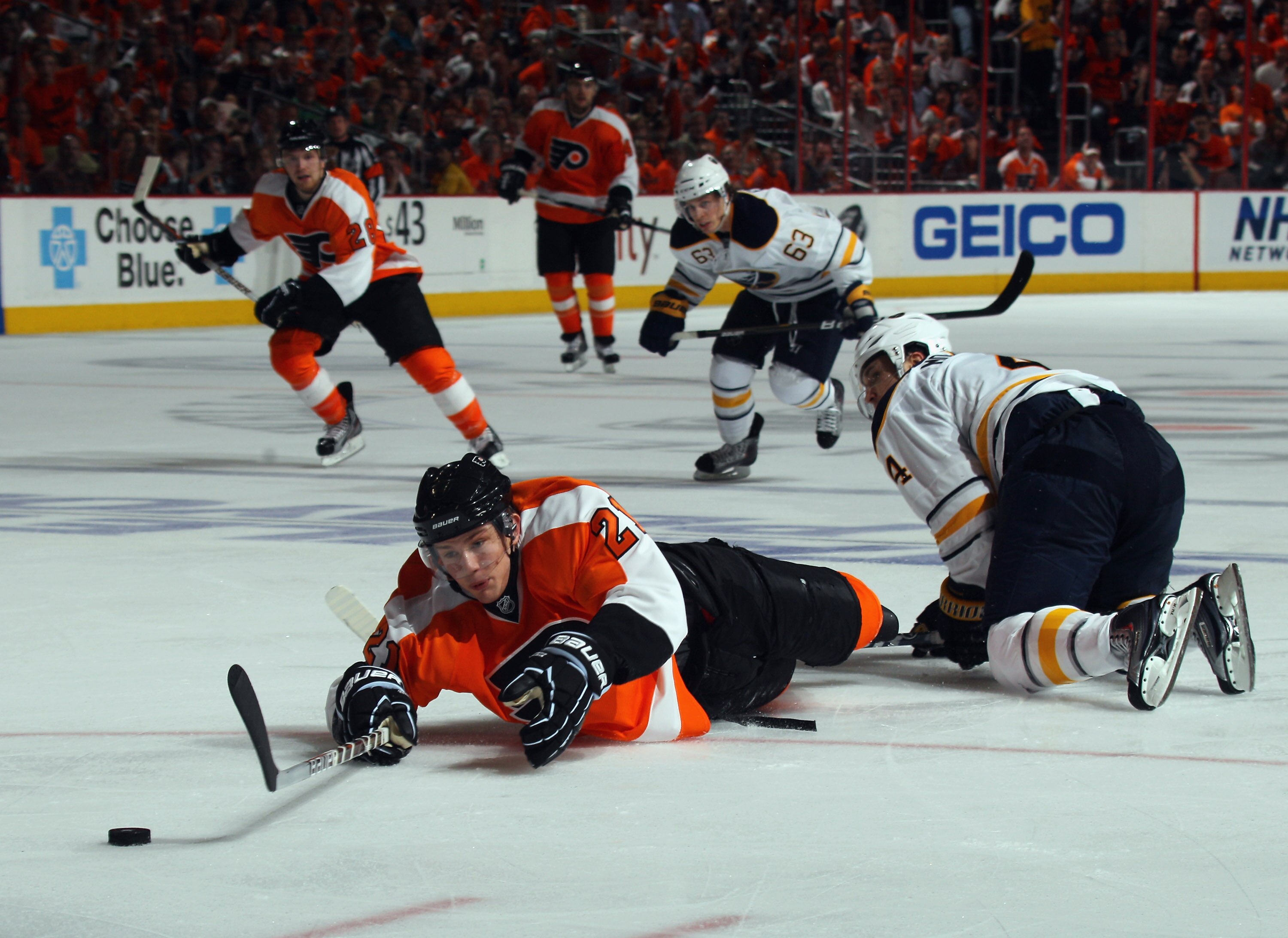 PHILADELPHIA, PA - APRIL 14:  Steve Montador #4 of the Buffalo Sabres takes a two minute penalty for tripping James van Riemsdyk #21 of the Philadelphia Flyers in Game One of the Eastern Conference Quarterfinals during the 2011 NHL Stanley Cup Playoffs at