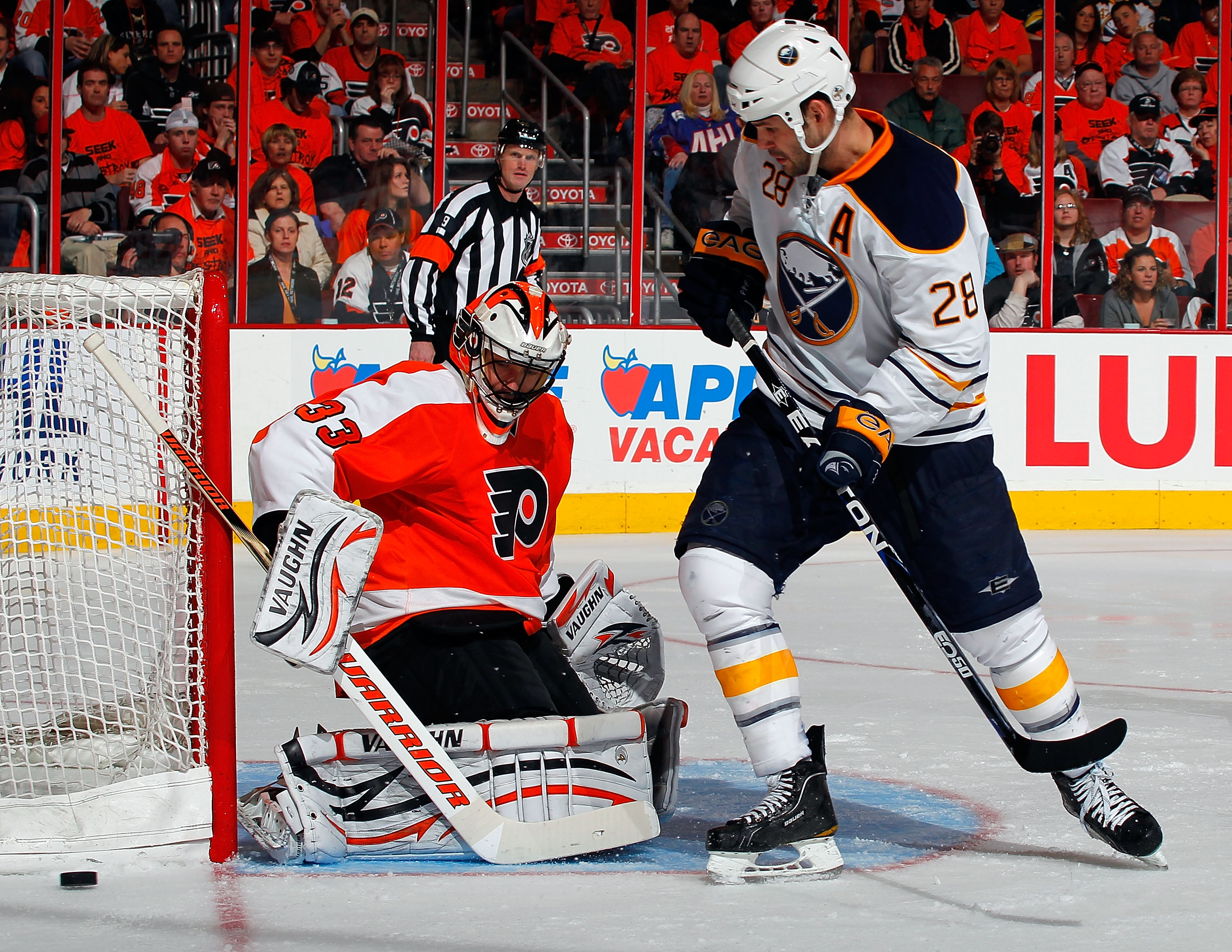 PHILADELPHIA, PA - APRIL 16:  Paul Gaustad #28 of the Buffalo Sabres watche goalie Brian Boucher #33 of the Philadelphia Flyers stop his shot during the third period of Game Two of the Eastern Conference Quarterfinals during the 2011 NHL Stanley Cup Playo