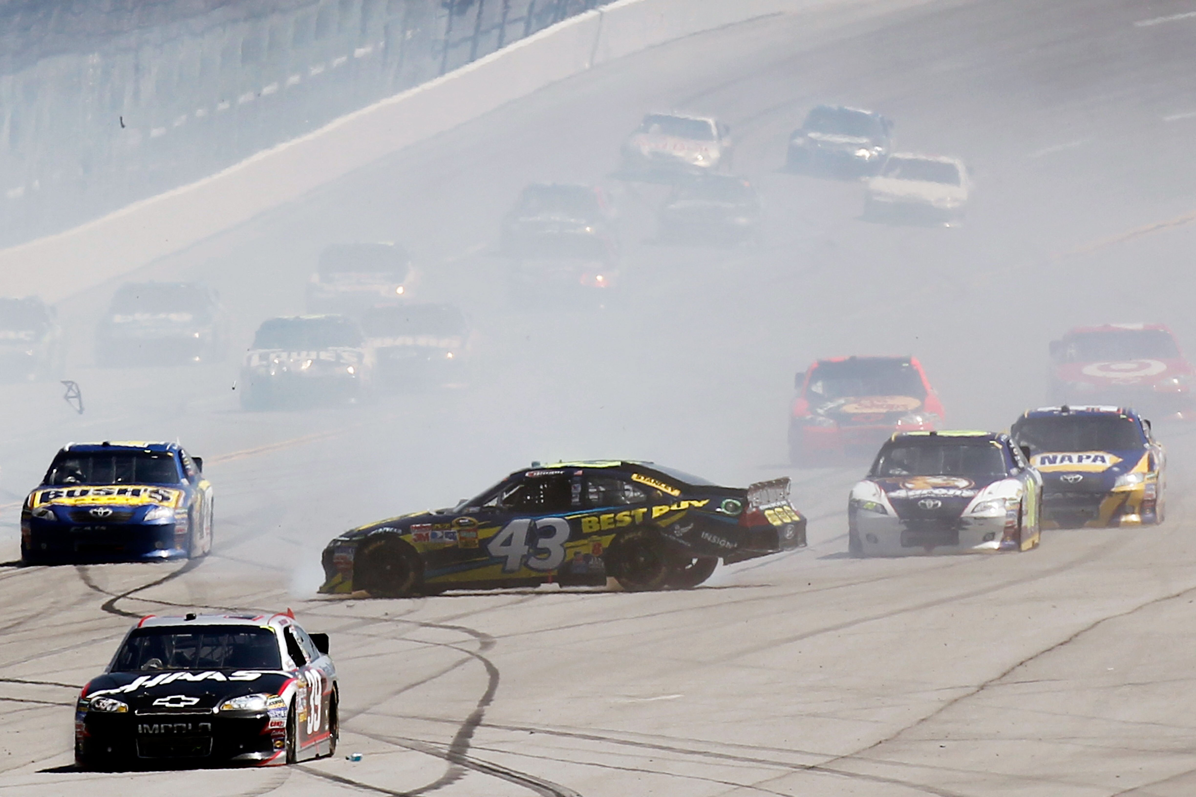 TALLADEGA, AL - APRIL 17:  A.J. Allmendinger, driver of the #43 Best Buy Ford, spins out after an incident in the NASCAR Sprint Cup Series Aaron's 499 at Talladega Superspeedway on April 17, 2011 in Talladega, Alabama.  (Photo by Jeff Zelevansky/Getty Ima