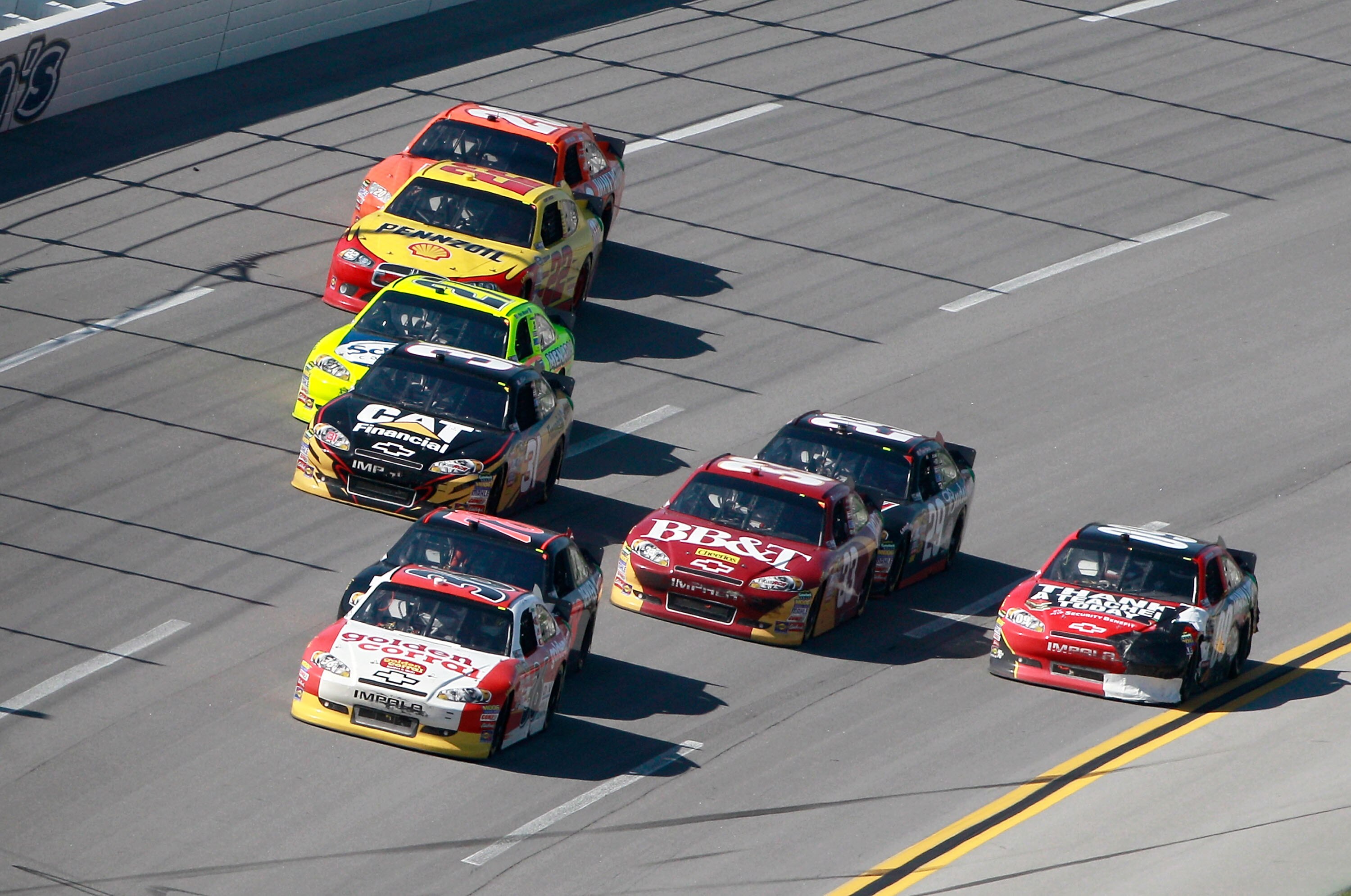 TALLADEGA, AL - APRIL 17:  Dave Blaney, driver of the #26 Golden Corral Chevrolet, leads a pack of cars during the NASCAR Sprint Cup Series Aaron's 499 at Talladega Superspeedway on April 17, 2011 in Talladega, Alabama.  (Photo by Jerry Markland/Getty Ima