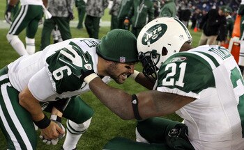 FOXBORO, MA - JANUARY 16:  Mark Sanchez #6 and LaDainian Tomlinson #21 of the New York Jets celebrate after the Jets defeated the Patriots 28 to 21 in their 2011 AFC divisional playoff game at Gillette Stadium on January 16, 2011 in Foxboro, Massachusetts