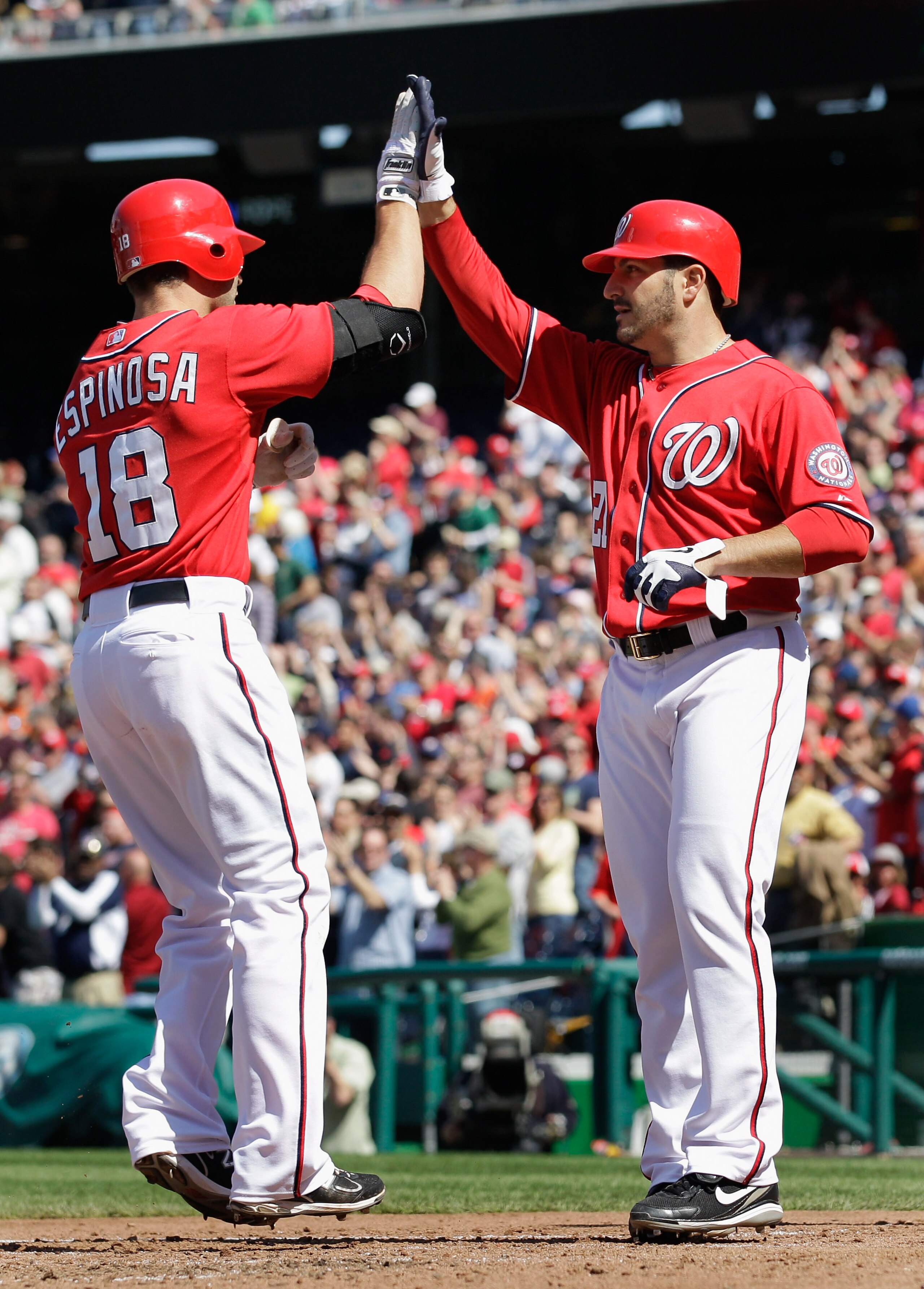 WASHINGTON, DC - APRIL 17:  Danny Espinosa #18 of the Washington Nationals celebrates with pitcher Jason Marquis #21 after Espinosa hit a three run home run during the fifth inning against the Milwaukee Brewers during the first game of a doubleheader at N
