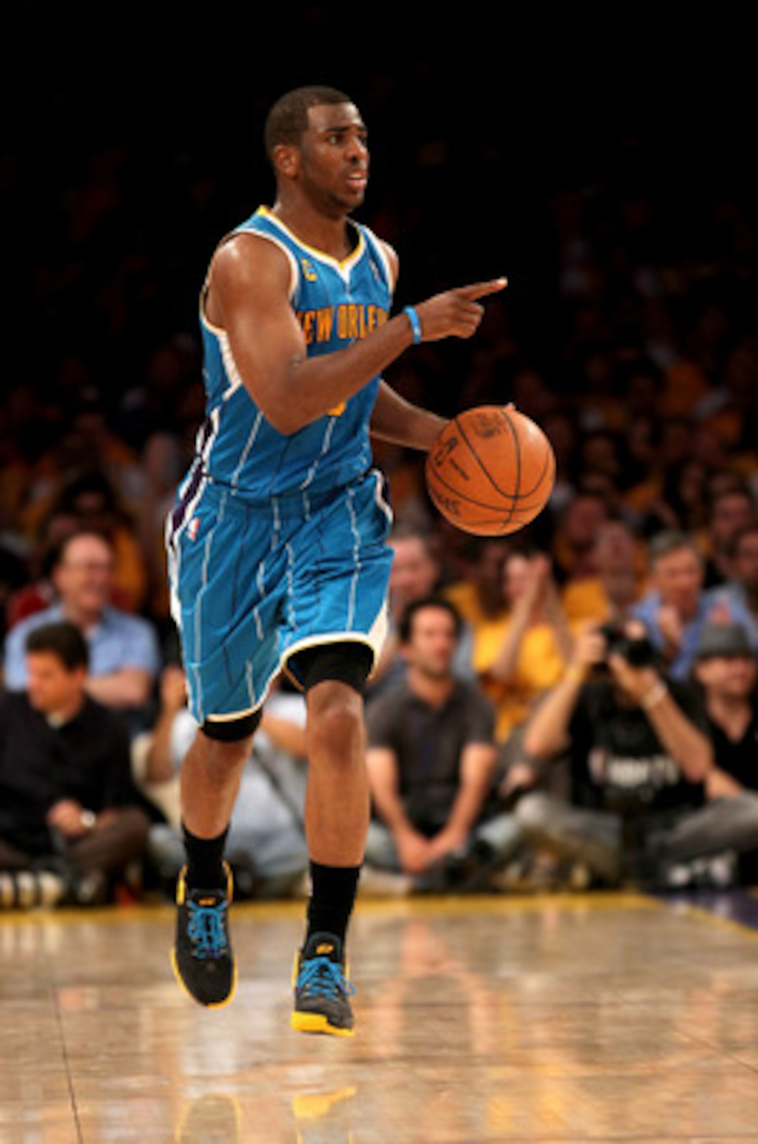 LOS ANGELES, CA - APRIL 17:  Chris Paul #3 of the New Orleans Hornets directs the offense as he brings the ball up court against the Los Angeles Lakers in Game One of the Western Conference Quarterfinals in the 2011 NBA Playoffs on April 17, 2011 at Stapl