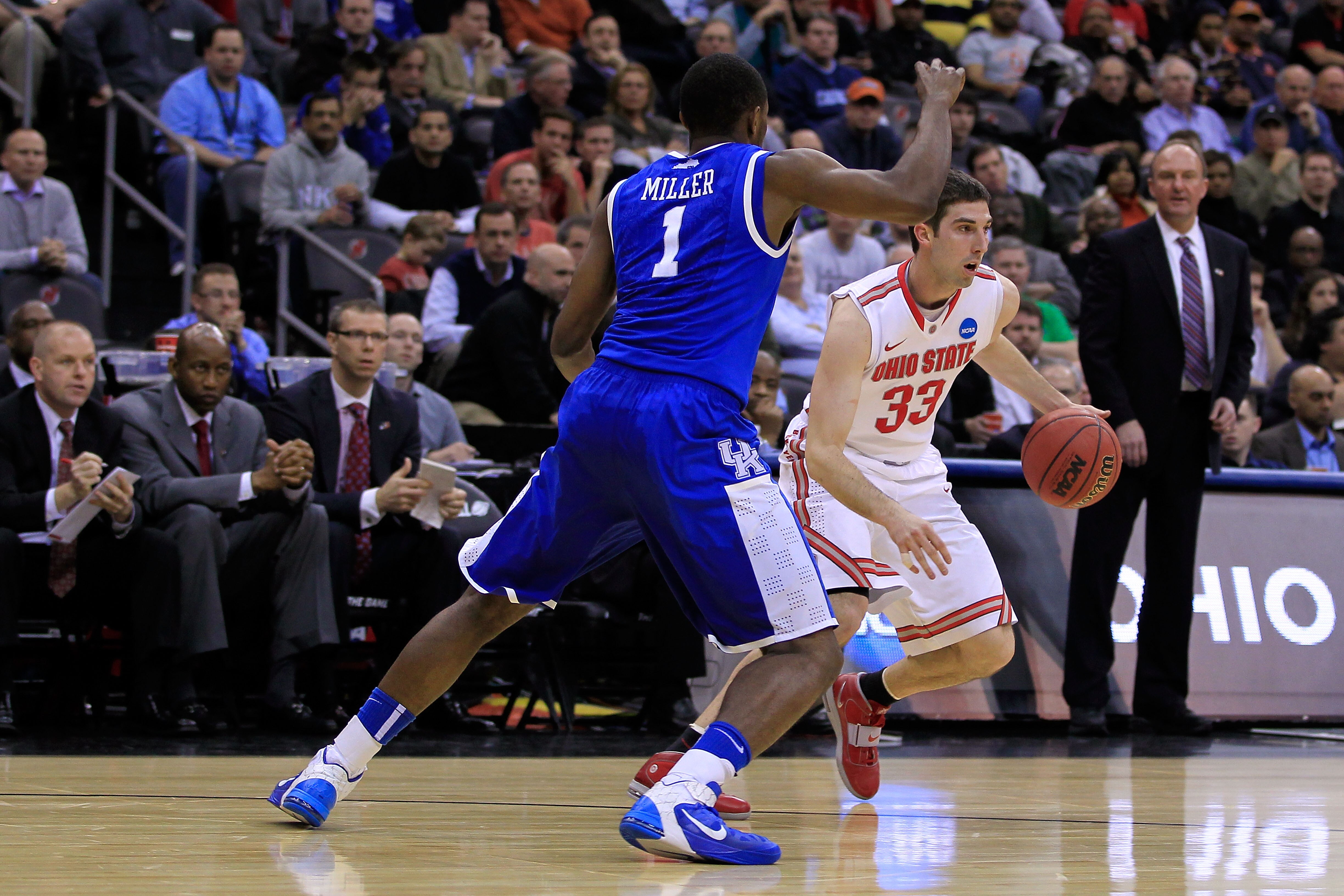 NEWARK, NJ - MARCH 25:  Jon Diebler #33 of the Ohio State Buckeyes in action against Darius Miller #1 of the Kentucky Wildcats during the east regional semifinal of the 2011 NCAA Men's Basketball Tournament at the Prudential Center on March 25, 2011 in Ne