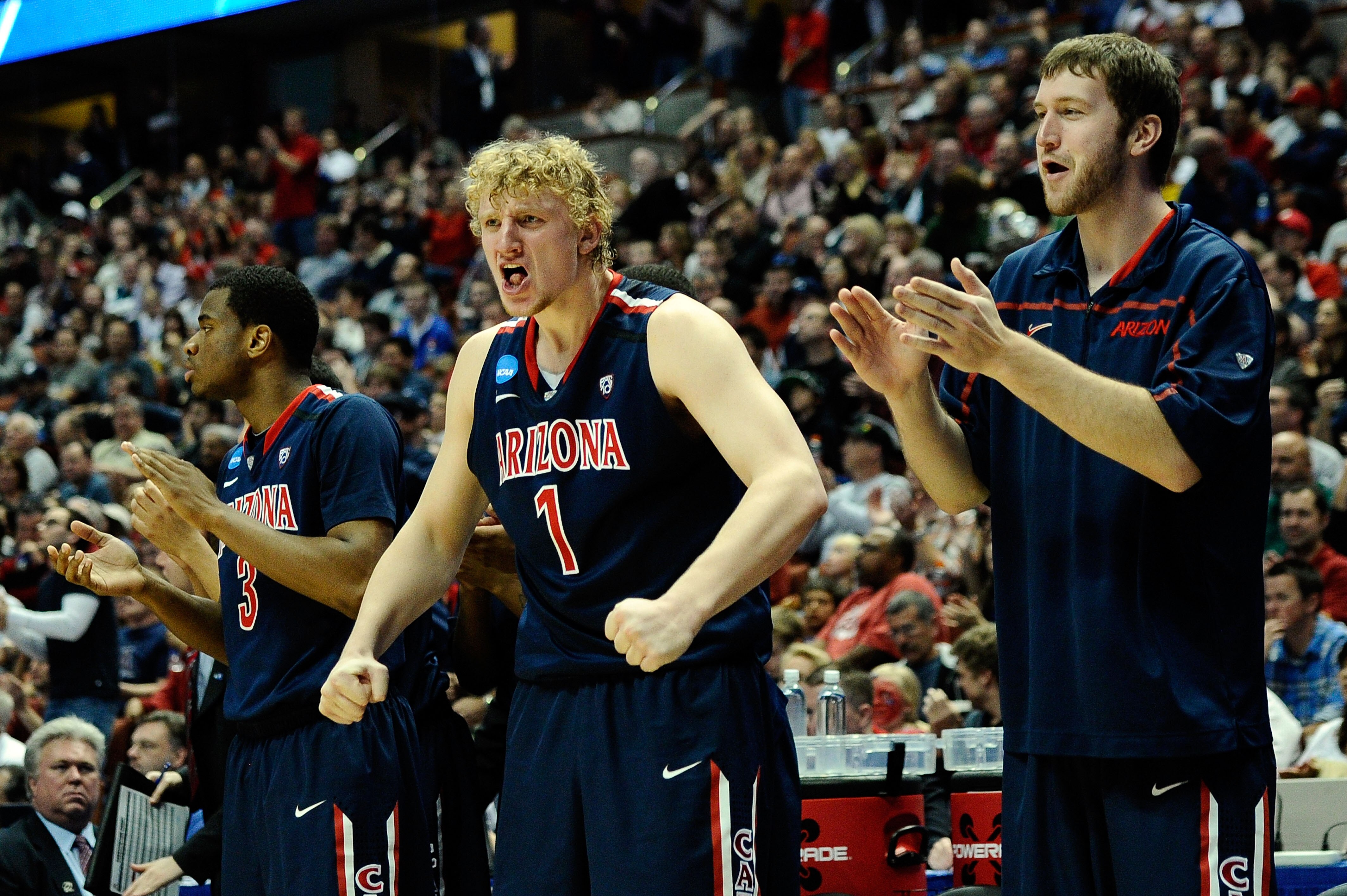 ANAHEIM, CA - MARCH 26:  Kevin Parrom #3 and Kyryl Natyazhko #1 of the Arizona Wildcats reacts from the bench against the Connecticut Huskies during the west regional final of the 2011 NCAA men's basketball tournament at the Honda Center on March 26, 2011