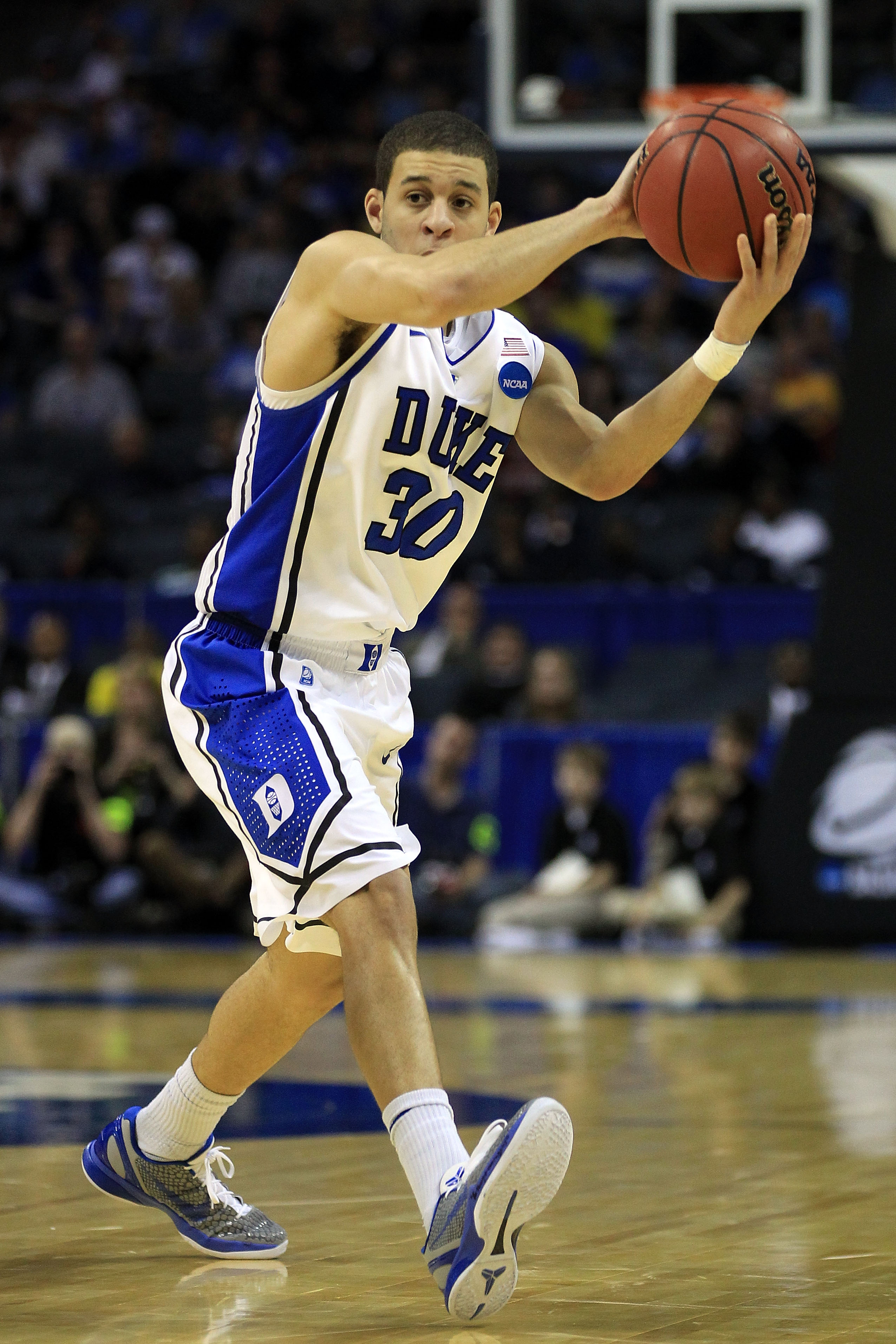 CHARLOTTE, NC - MARCH 20:  Seth Curry #30 of the Duke Blue Devils moves the ball while taking on the Michigan Wolverines during the third round of the 2011 NCAA men's basketball tournament at Time Warner Cable Arena on March 20, 2011 in Charlotte, North C