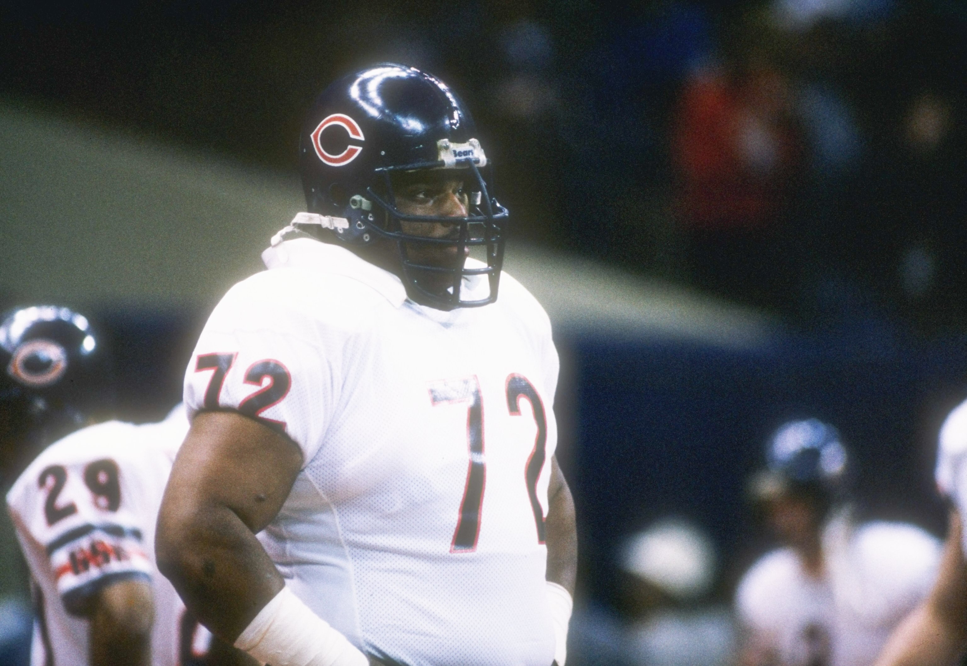 26  Jan 1986:  Defensive lineman William (Refrigerator) Perry of the Chicago Bears watches  from the side during the Super Bowl  XX  game with the New England Patriots at the Louisiana Superdome in New Orleans, Louisiana.  The Bears won the game, 46-10.