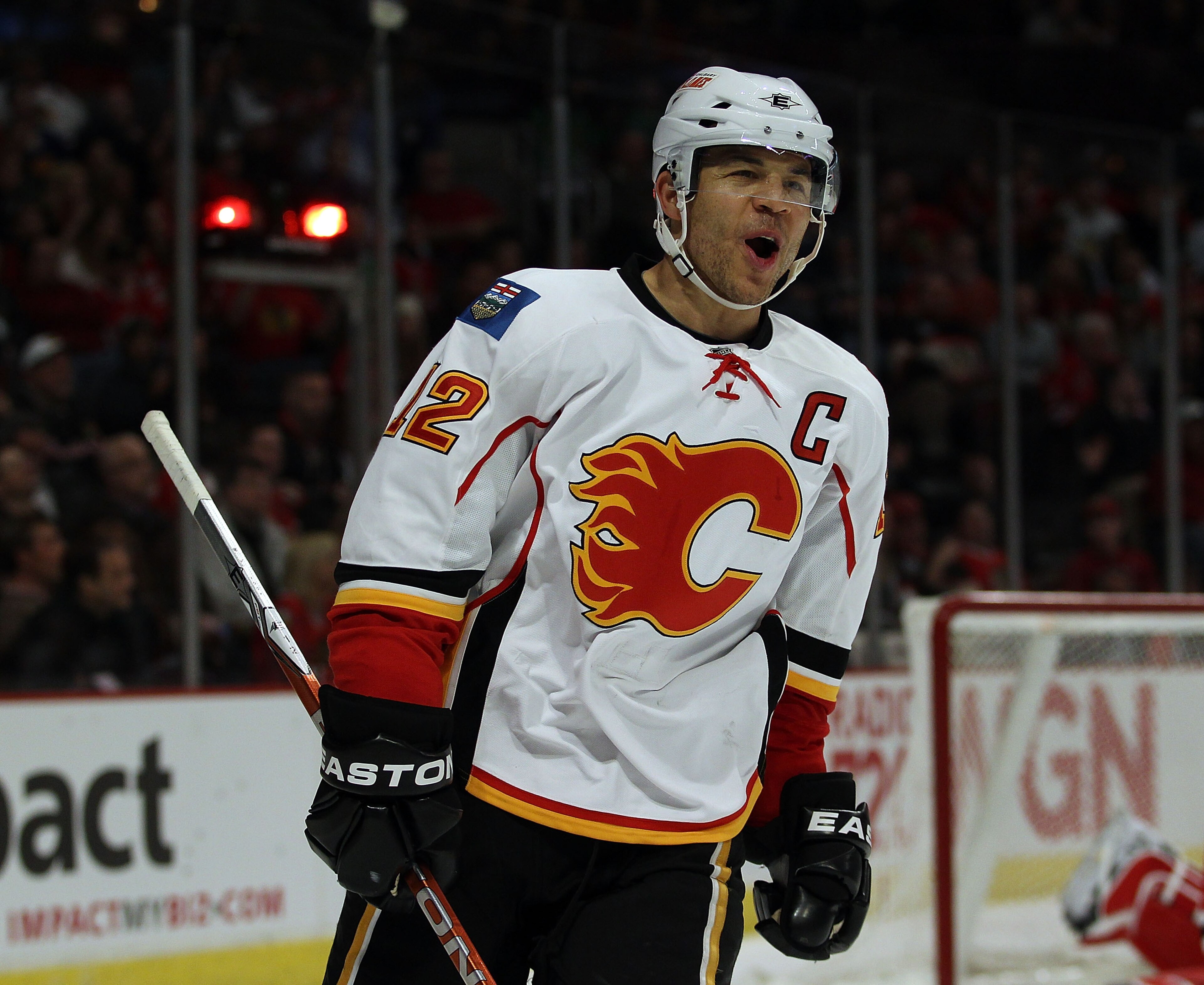 CHICAGO, IL - MARCH 02: Jarome Iginla #12 of the Calgary Flames celebrates a 3rd period goal by teammate Rene Bourque against the Chicago Blackhawks at the United Center on March 2, 2011 in Chicago, Illinois. The Blackhawks defeated the Flames 6-4. (Photo CHICAGO, IL - MARCH 02: Jarome Iginla #12 of the Calgary Flames celebrates a 3rd period goal by teammate Rene Bourque against the Chicago Blackhawks at the United Center on March 2, 2011 in Chicago, Illinois. The Blackhawks defeated the Flames 6-4. (Photo