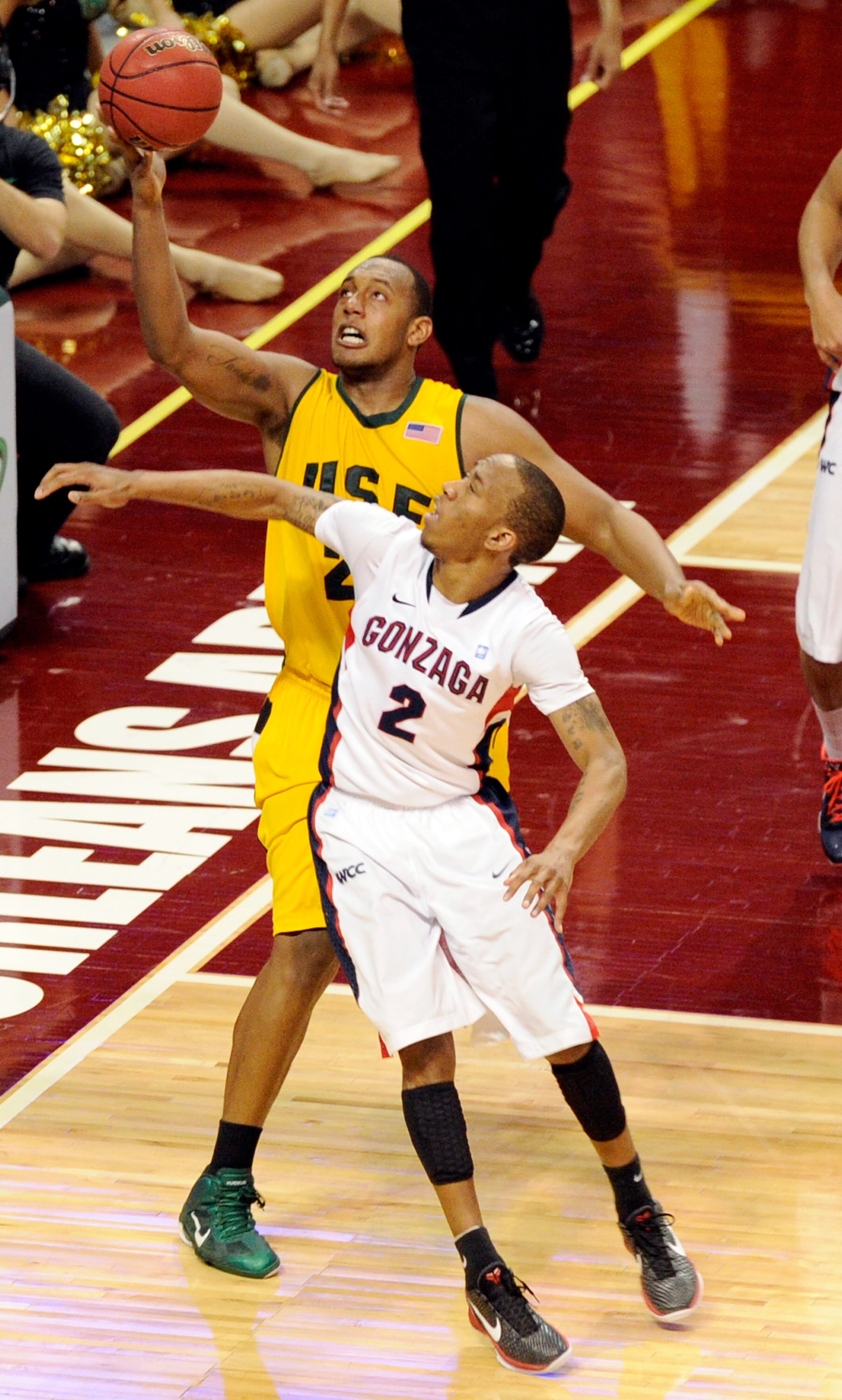 LAS VEGAS, NV - MARCH 06:  Perris Blackwell #22 of the San Francisco Dons grabs a rebound over Marquise Carter #2 of the Gonzaga Bulldogs during a semifinal game of the Zappos.com West Coast Conference Basketball tournament at the Orleans Arena March 6, 2