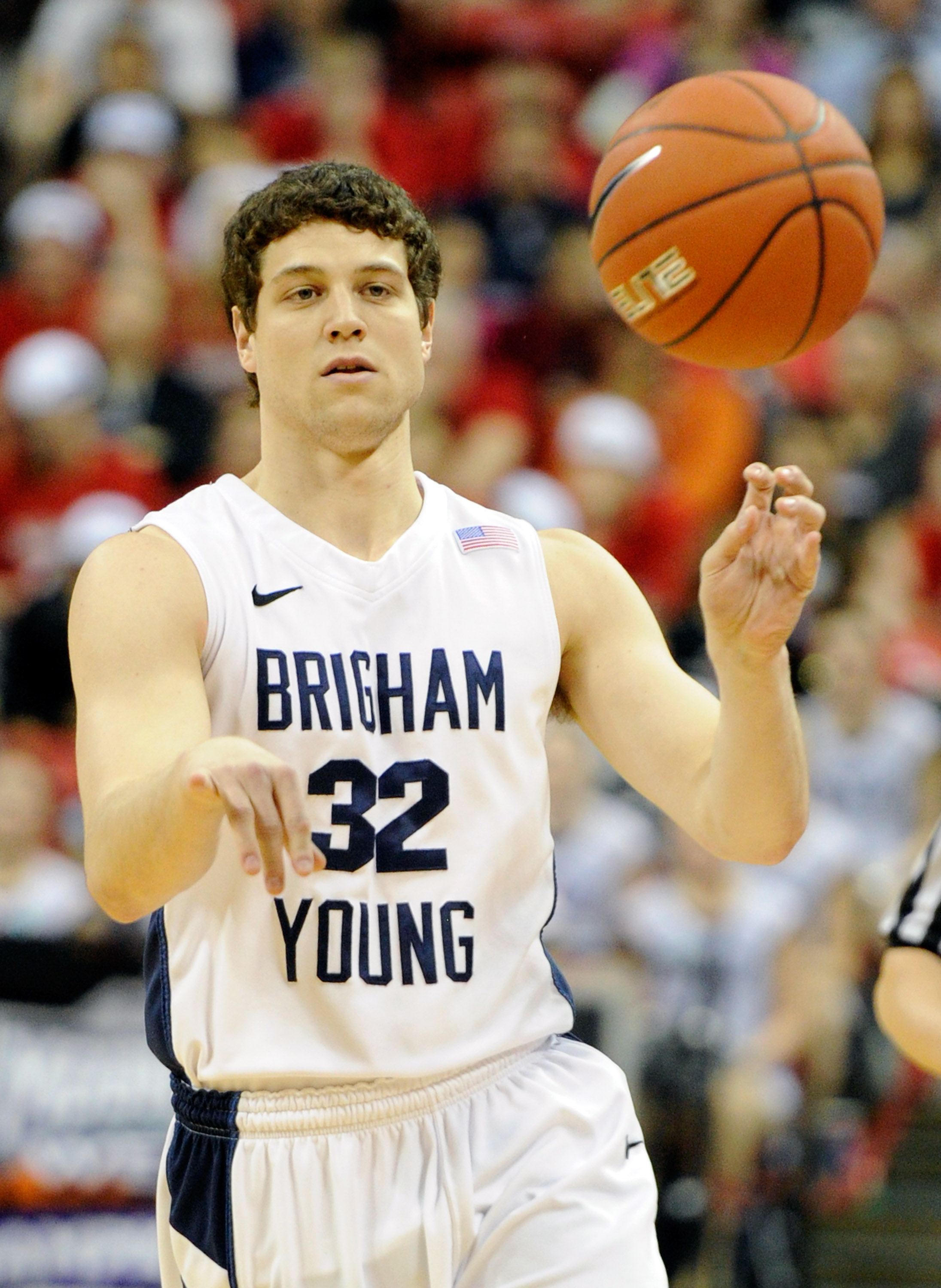 LAS VEGAS, NV - MARCH 12:  Jimmer Fredette #32 of the Brigham Young University Cougars passes the ball during the championship game of the Conoco Mountain West Conference Basketball tournament against the San Diego State Aztecs at the Thomas & Mack Center
