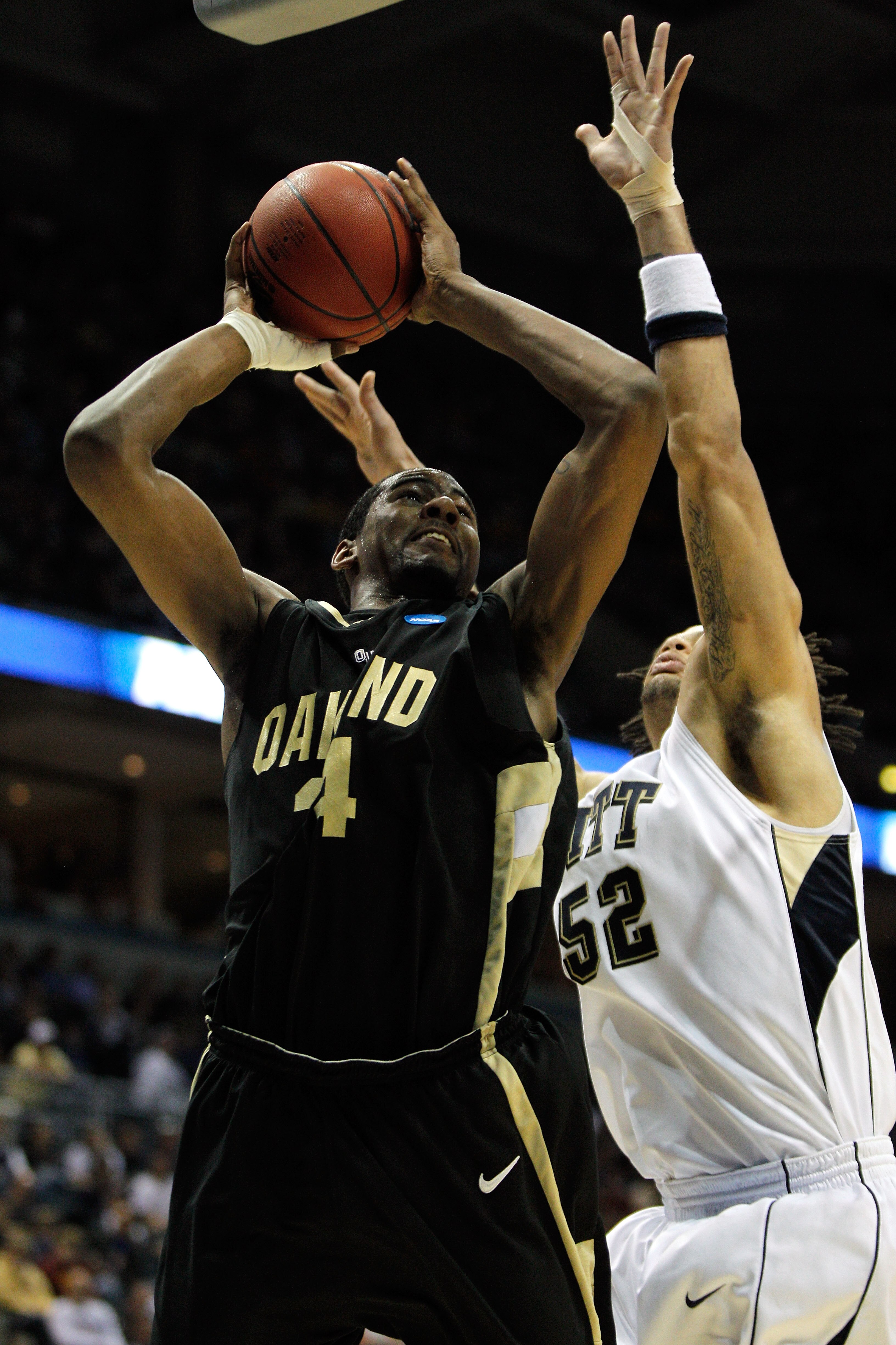 MILWAUKEE - MARCH 19:  Keith Benson #34 of the Oakland Golden Grizzlies shoots the ball over Gary McGhee #52 of the Pittsburgh Panthers in the first half during the first round of the 2010 NCAA men's basketball tournament at the Bradley Center on March 19