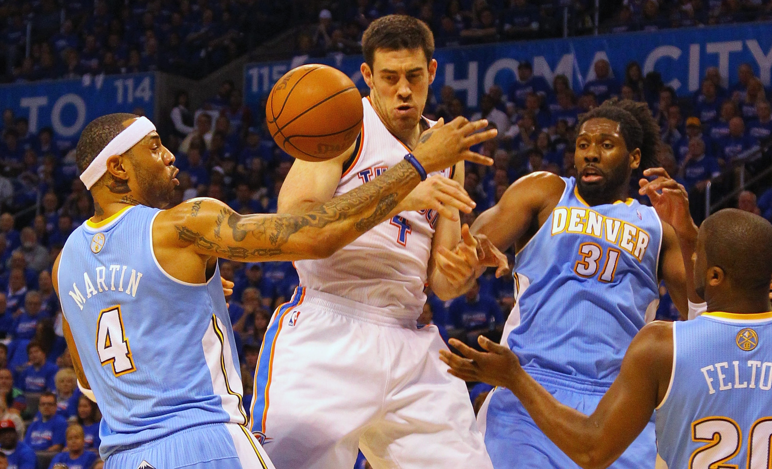 OKLAHOMA CITY, OK - APRIL 17: Nick Collison #4 of the Oklahoma City Thunder fights for a rebound against Kenyon Martin #4 and Nene #31 of the Denver Nuggets in Game One of the Western Conference Quarterfinals in the 2011 NBA Playoffs on April 17, 2011 at OKLAHOMA CITY, OK - APRIL 17: Nick Collison #4 of the Oklahoma City Thunder fights for a rebound against Kenyon Martin #4 and Nene #31 of the Denver Nuggets in Game One of the Western Conference Quarterfinals in the 2011 NBA Playoffs on April 17, 2011 at