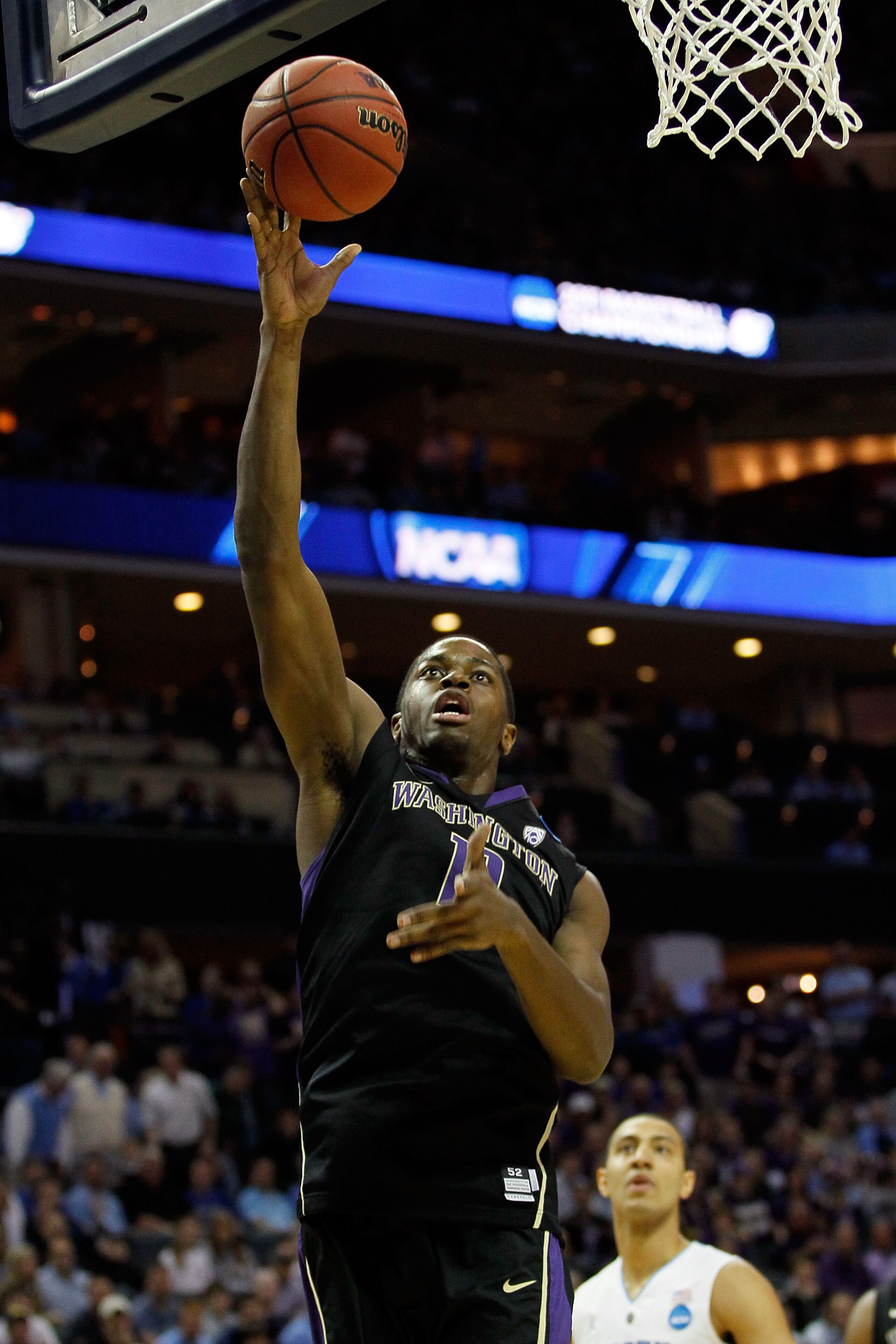 CHARLOTTE, NC - MARCH 20: Matthew Bryan-Amaning #11 of the Washington Huskies lays the ball up while taking on the North Carolina Tar Heels during the third round of the 2011 NCAA men's basketball tournament at Time Warner Cable Arena on March 20, 2011 i CHARLOTTE, NC - MARCH 20: Matthew Bryan-Amaning #11 of the Washington Huskies lays the ball up while taking on the North Carolina Tar Heels during the third round of the 2011 NCAA men's basketball tournament at Time Warner Cable Arena on March 20, 2011 i