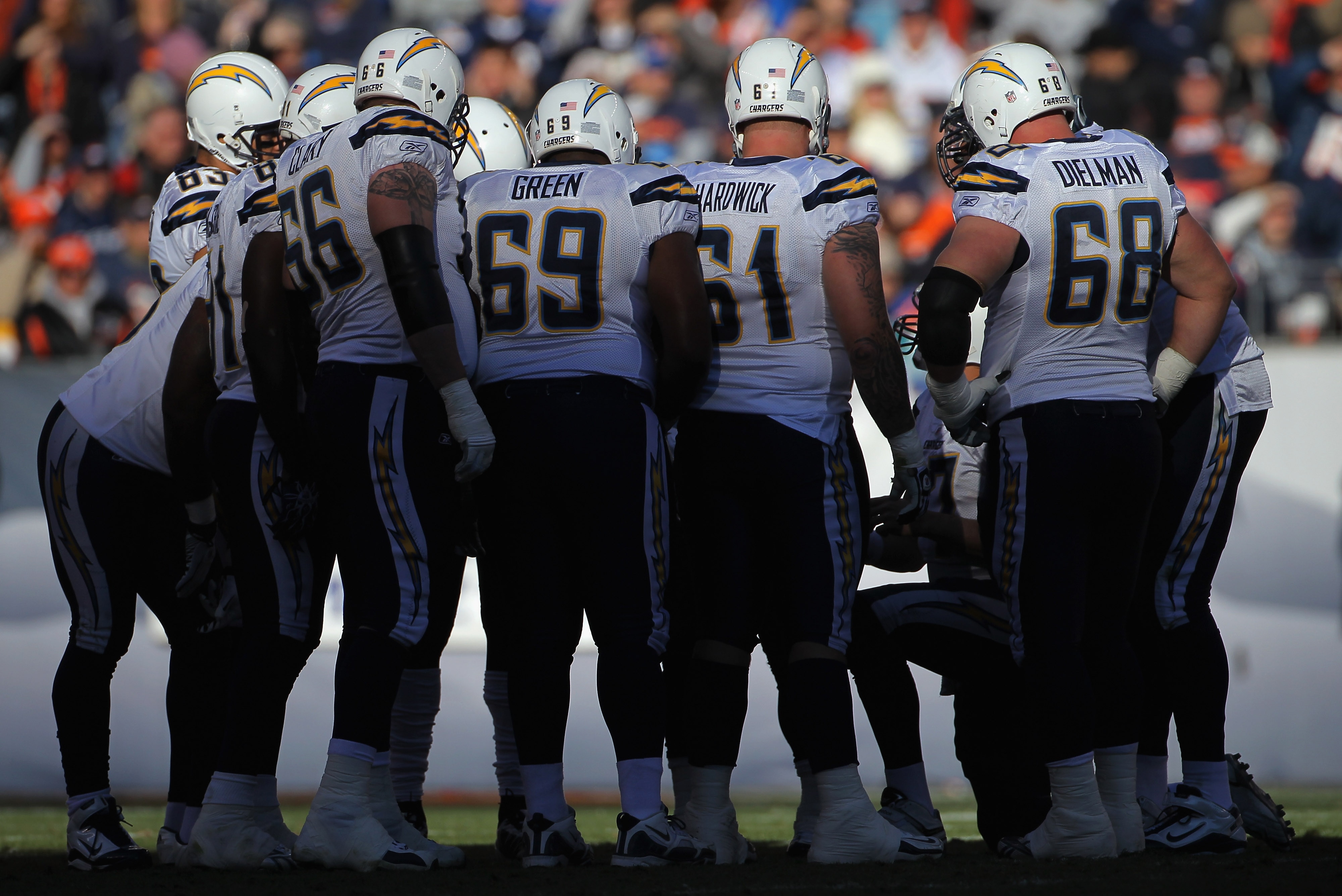 DENVER - JANUARY 02:  The San Diego Chargers offense huddles as they face the Denver Broncos at INVESCO Field at Mile High on January 2, 2011 in Denver, Colorado. The Chargers defeated the Broncos 33-28.  (Photo by Doug Pensinger/Getty Images)