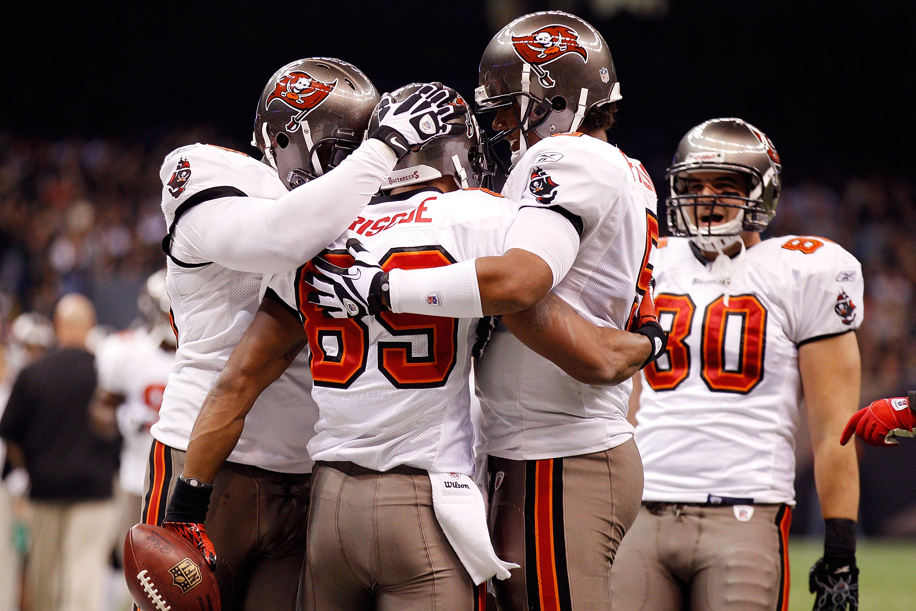 NEW ORLEANS, LA - JANUARY 02:  Quarterback Josh Freeman #5 celebrates after throwing a touchdown  with Dezmon Briscoe #89 of the Tampa Bay Buccaneers during the game against the New Orleans Saints at the Louisiana Superdome on January 2, 2011 in New Orlea