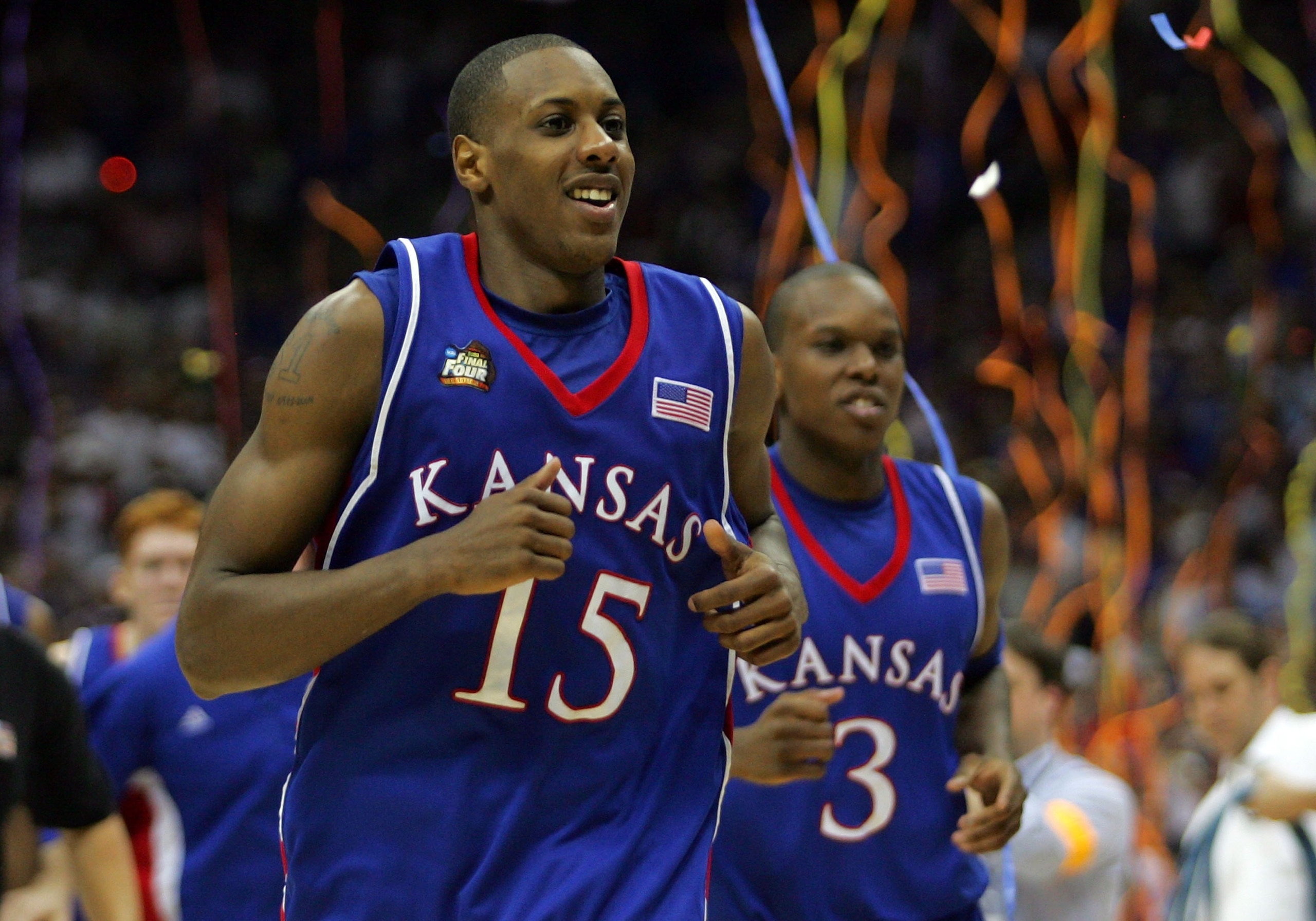 SAN ANTONIO - APRIL 07: Mario Chalmers #15 of the Kansas Jayhawks reacts along with teammate Russell Robinson #3 after the Jayhawks defeat the Memphis Tigers by a score of 75-68 in overtime during the 2008 NCAA Men's National Championship game at the Ala SAN ANTONIO - APRIL 07: Mario Chalmers #15 of the Kansas Jayhawks reacts along with teammate Russell Robinson #3 after the Jayhawks defeat the Memphis Tigers by a score of 75-68 in overtime during the 2008 NCAA Men's National Championship game at the Ala