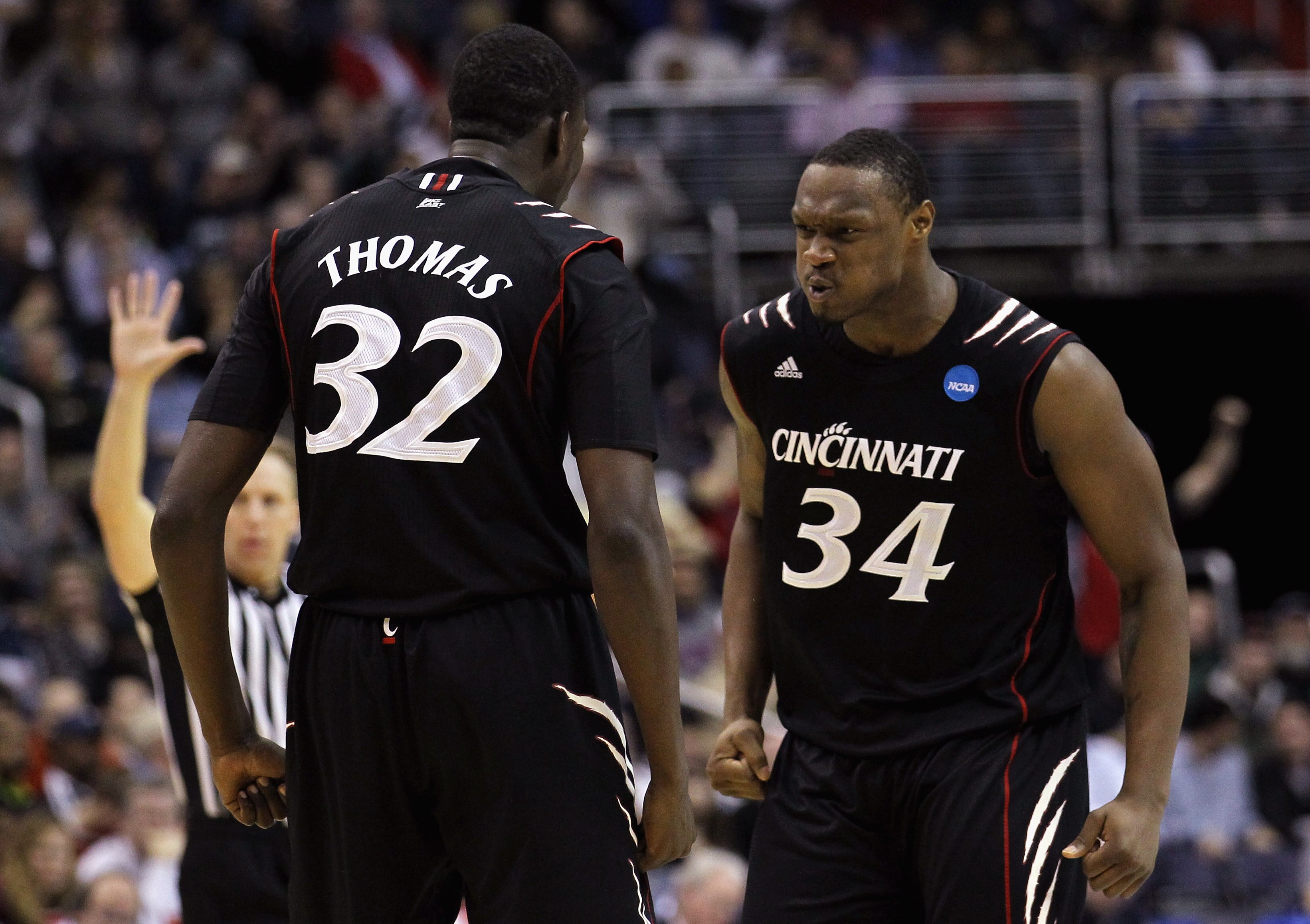 WASHINGTON - MARCH 19:  Ibrahima Thomas #32 of Cincinnati celebrates with teammate Yancy Gates #34 against Connecticut during the third round of the 2011 NCAA men's basketball tournament at Verizon Center on March 19, 2011 in Washington, DC.  (Photo by Ni