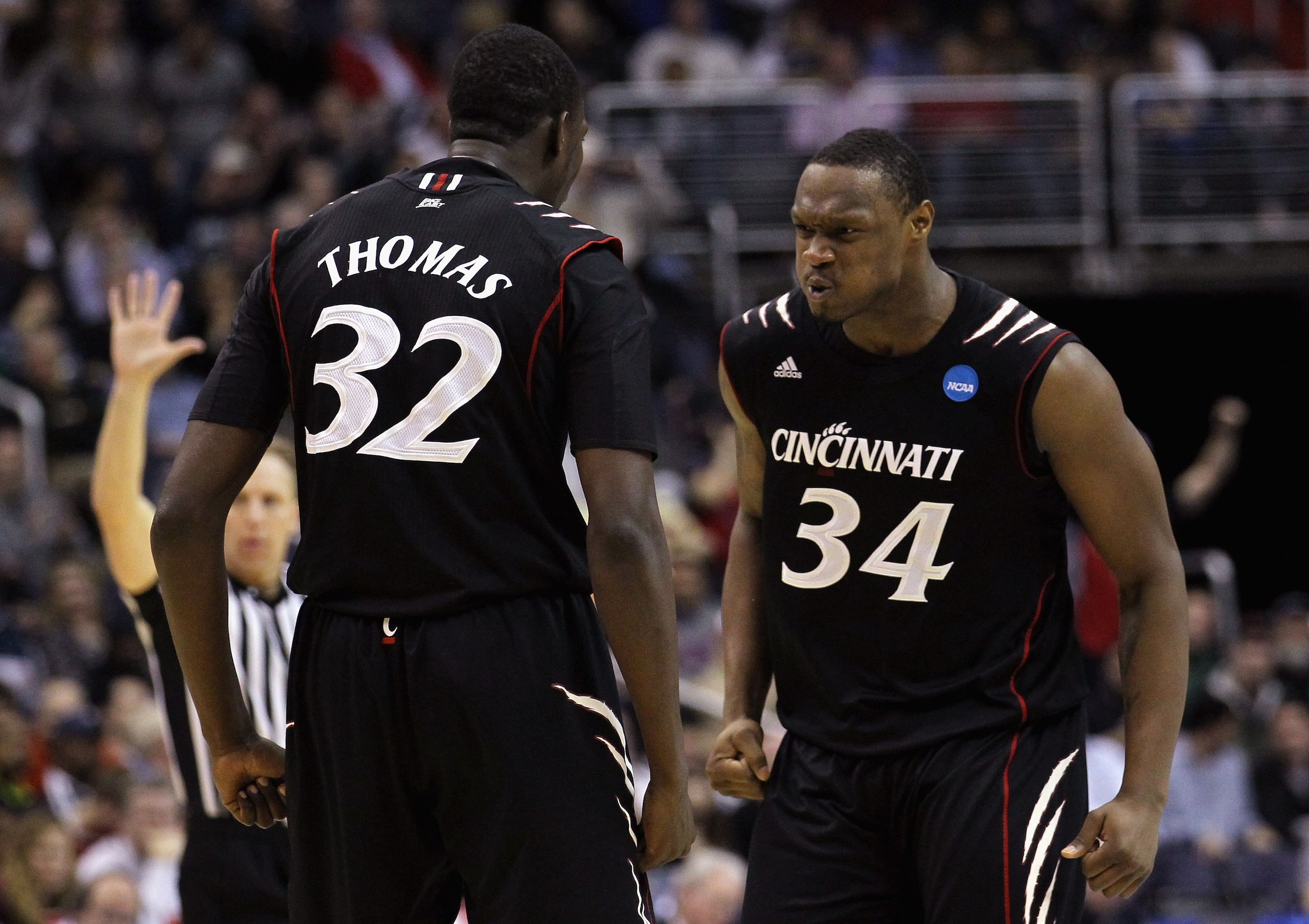 WASHINGTON - MARCH 19:  Ibrahima Thomas #32 of Cincinnati celebrates with teammate Yancy Gates #34 against Connecticut during the third round of the 2011 NCAA men's basketball tournament at Verizon Center on March 19, 2011 in Washington, DC.  (Photo by Ni