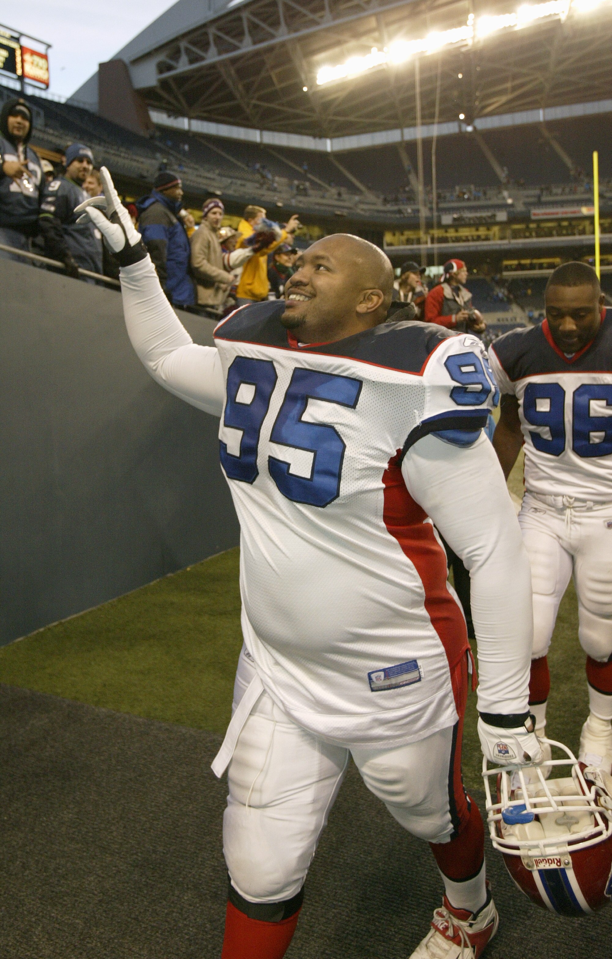 SEATTLE - NOVEMBER 28:  Defensive tackle Sam Adams #95 of the Buffalo Bills acknowledges the crowd as he walks off the field during the game against the Seattle Seahawks at Qwest Field on November 28, 2004 in Seattle, Washington. The Bills defeated the Se