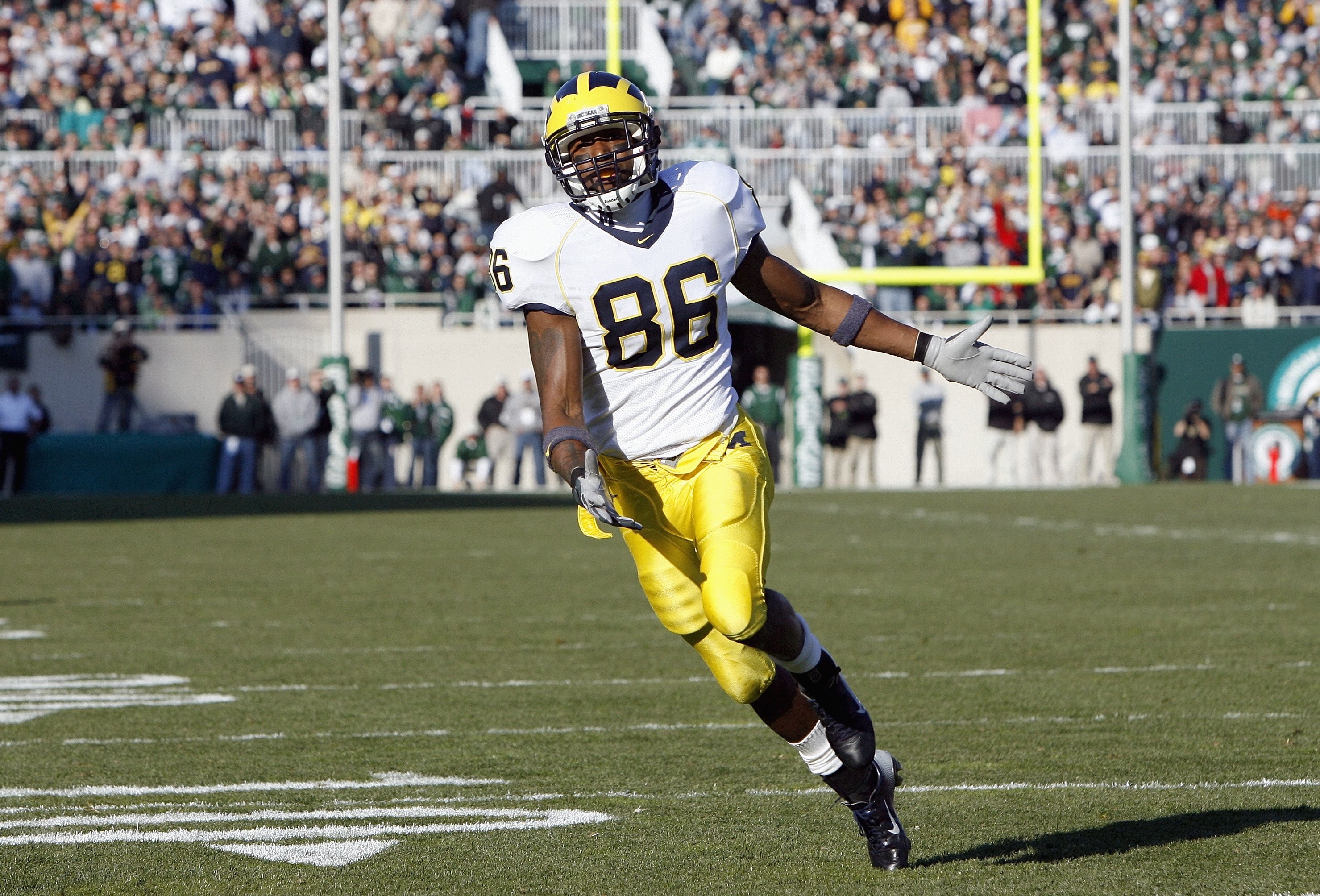 EAST LANSING, MI - NOVEMBER 3:  Mario Manningham #86 of the Michigan Wolverines runs on the field during the game against the Michigan State Spartans at Spartan Stadium November 3, 2007 in East Lansing, Michigan.  Michigan defeated Michigan State 28-24. (