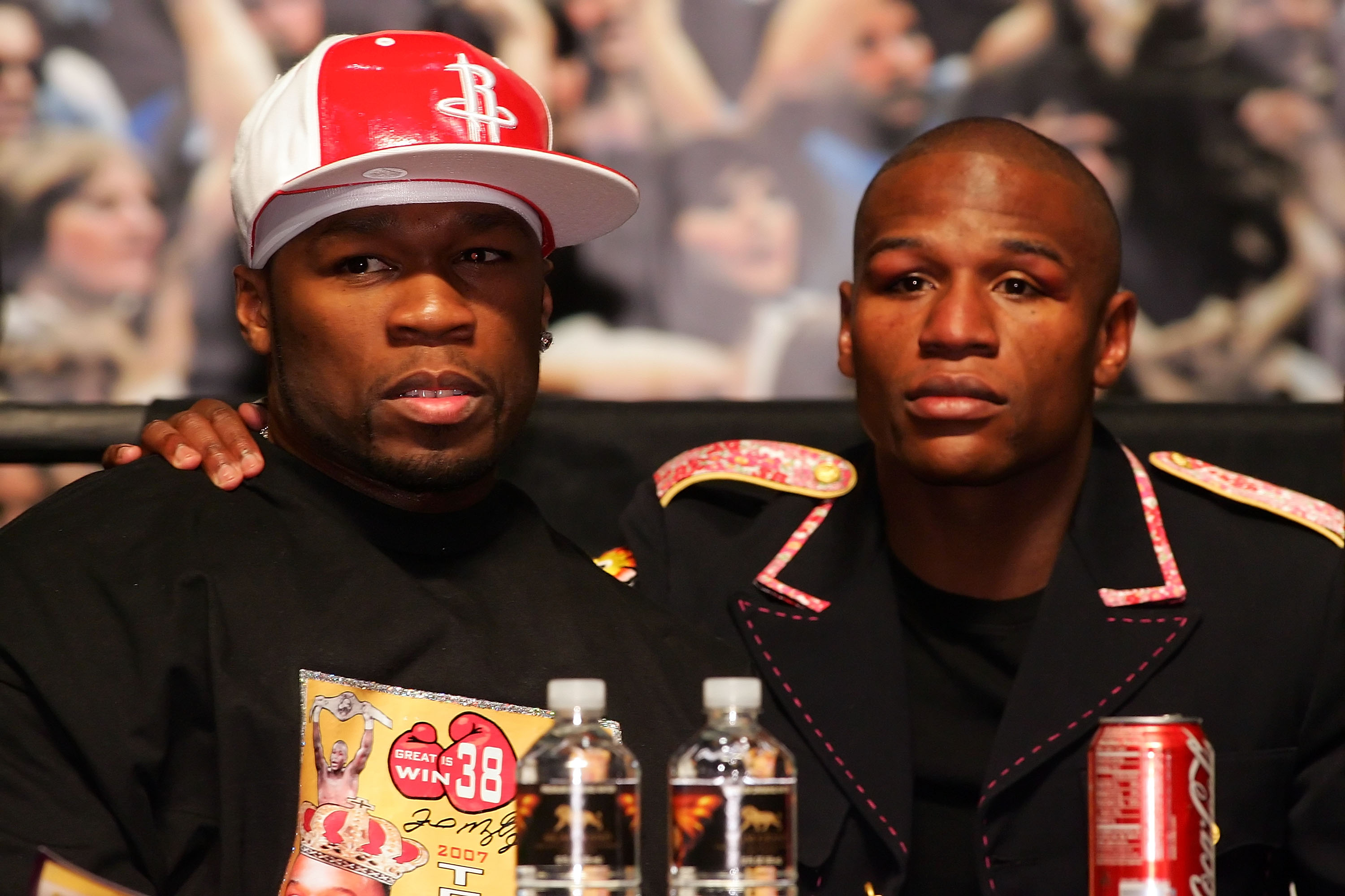 LAS VEGAS - MAY 05:  (L-R) Rapper 50 Cent and Floyd Mayweather Jr. embrace during the post-fight news conference after Mayweather defeated Oscar De La Hoya by split decision after their WBC super welterweight championship fight at the MGM Grand Garden Are