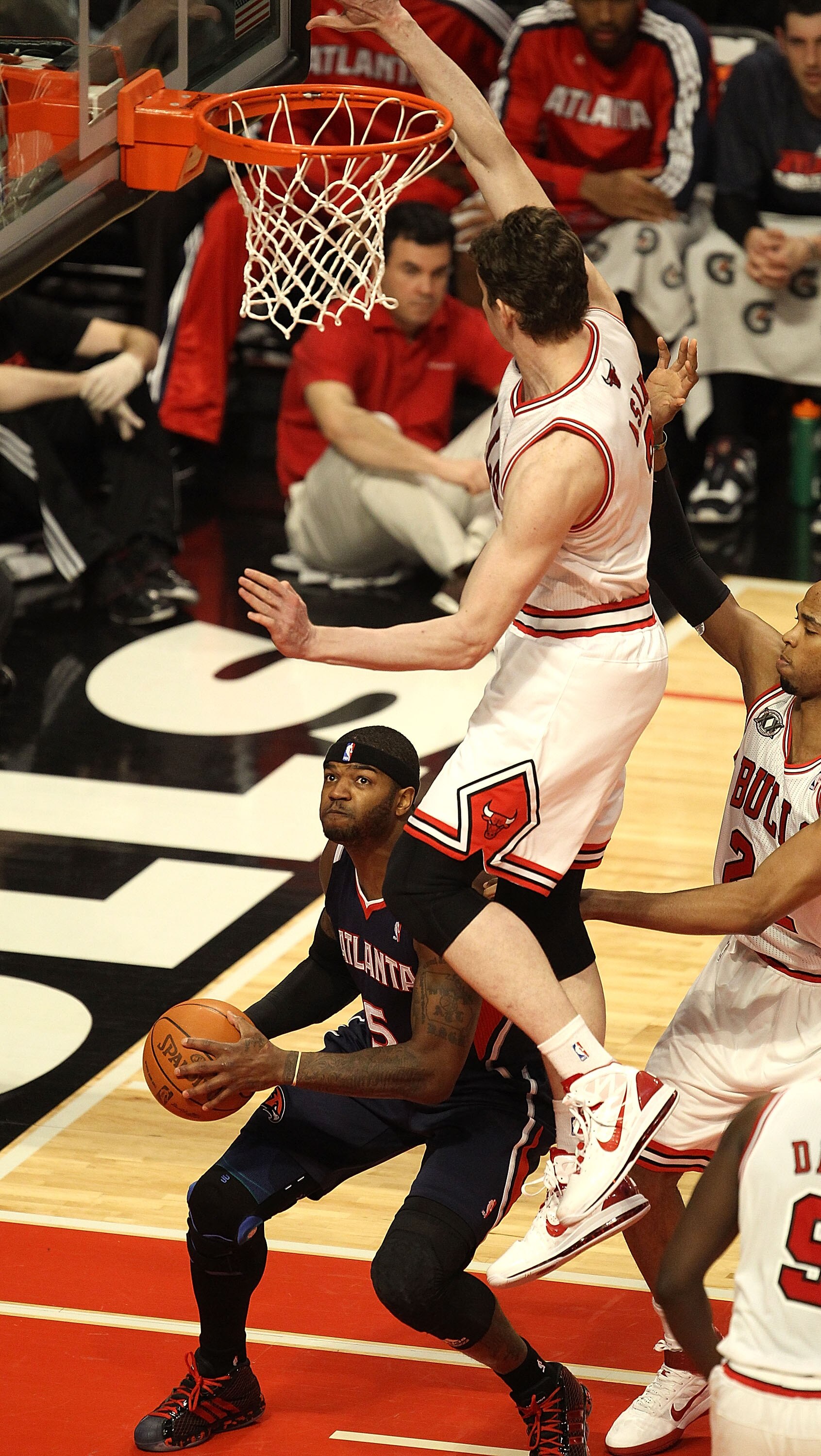 CHICAGO, IL - MARCH 11: Josh Smith #5 of the Atlanta Hawks waits to shoot as Omer Asik #3 of the Chicago Bulls leaps and fouls him at the United Center on March 11, 2011 in Chicago, Illinois. NOTE TO USER: User expressly acknowledges and agrees that, by d