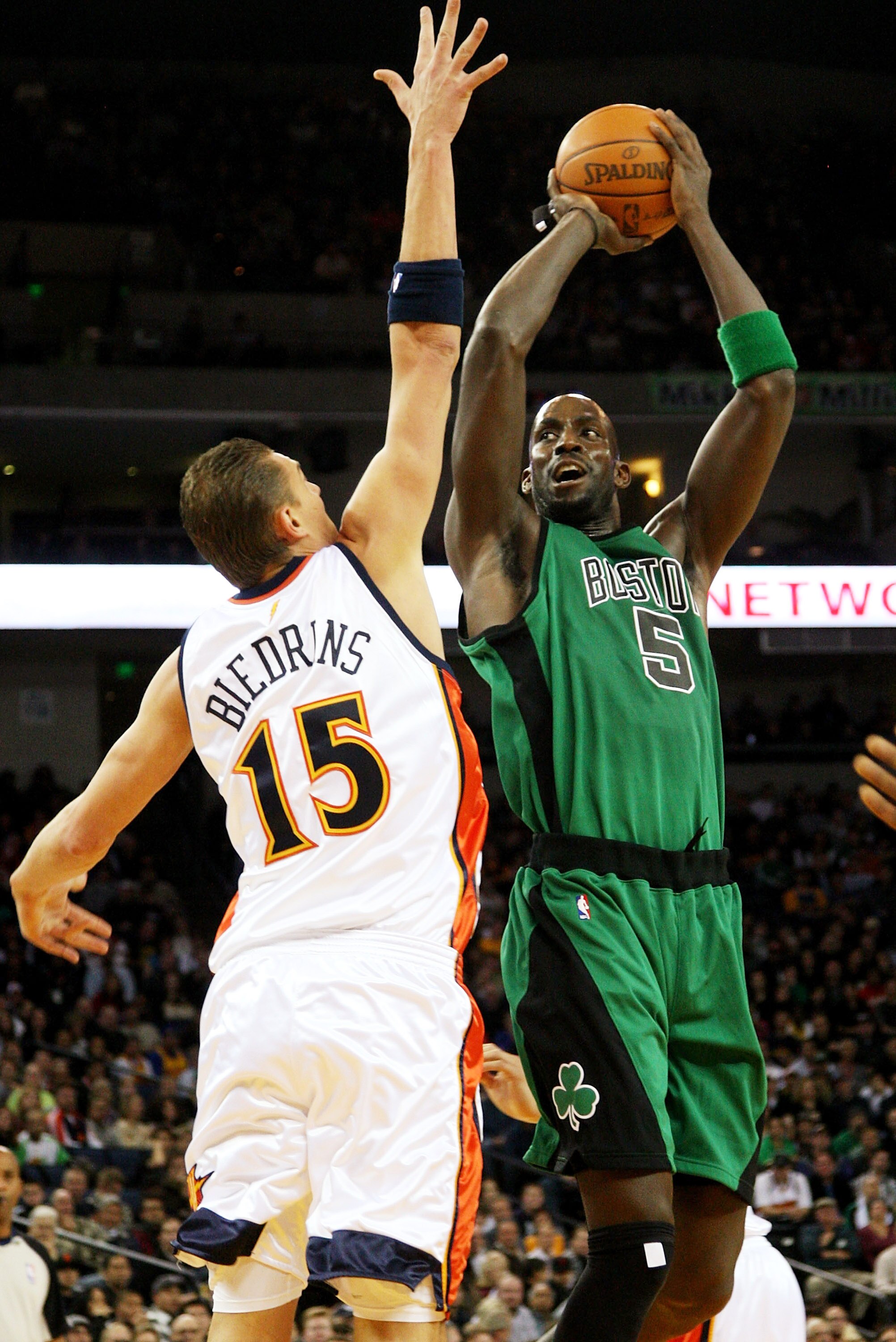 OAKLAND, CA - DECEMBER 28:  Kevin Garnett #5 of the Boston Celtics shoots over Andris Biedrins #15 of the Golden State Warriors during an NBA game at Oracle Arena on December 28, 2009 in Oakland, California. NOTE TO USER: User expressly acknowledges and a